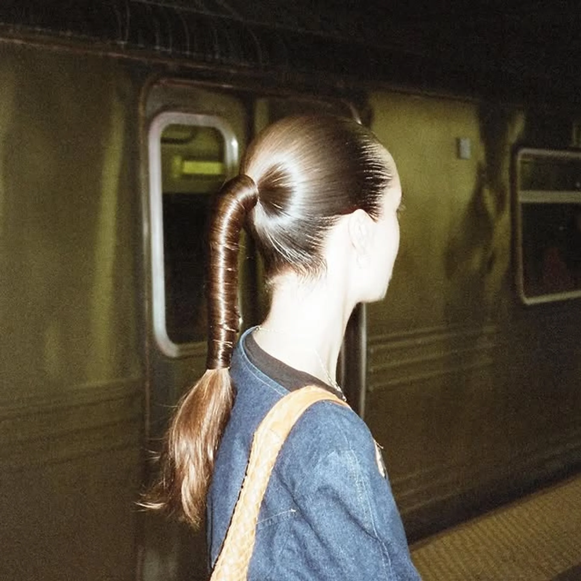 A woman sporting a sleek high ponytail, exemplifying power and modern elegance. - Preview 1