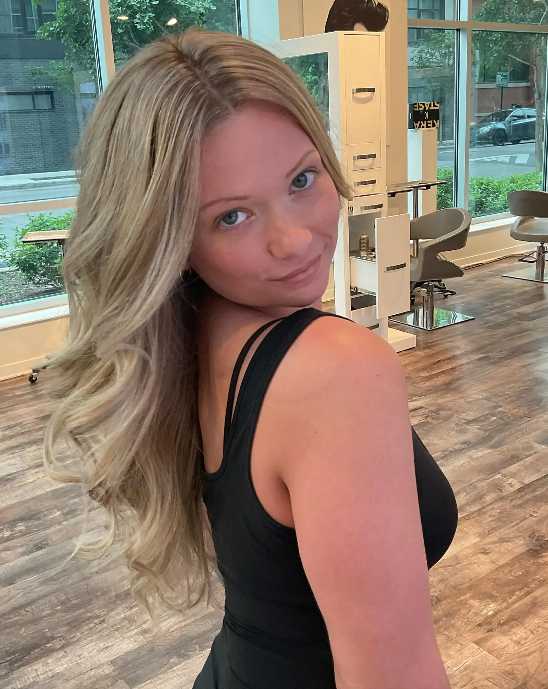 Long layered hair with loose beach waves, balayage, and bronde color. 3