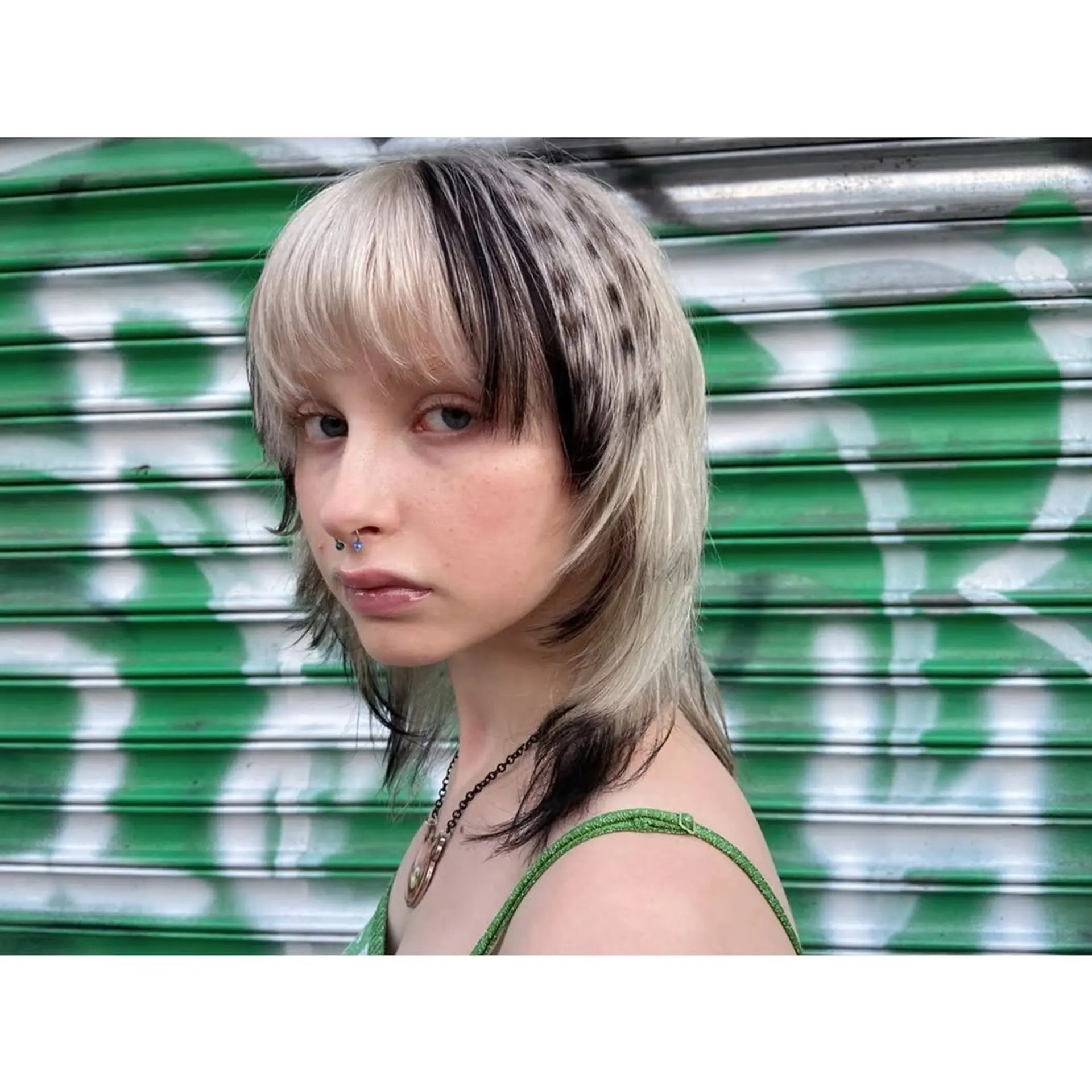 A modern shag haircut with choppy layers and bold two-tone color. 1