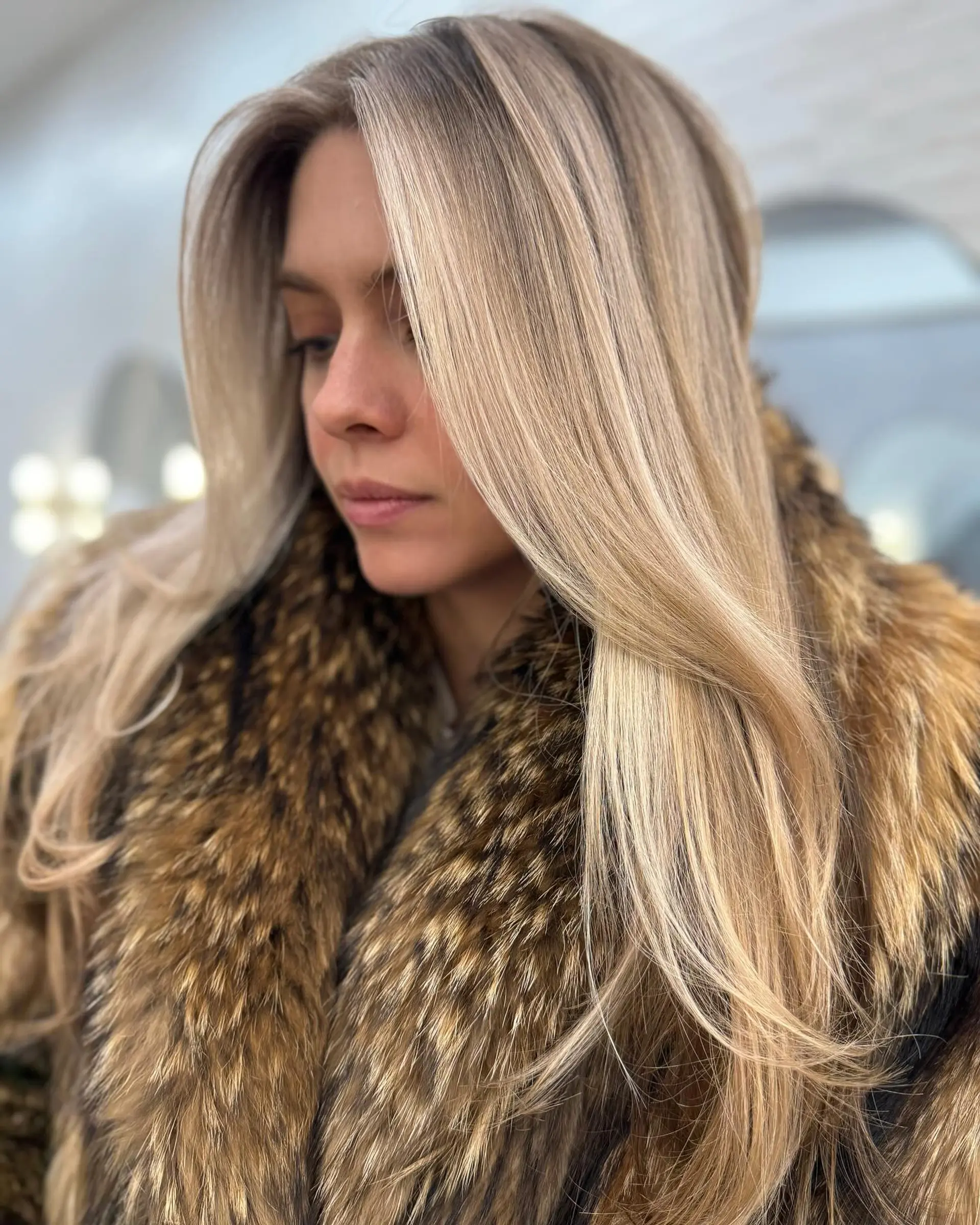 Straight, smooth long hair styled with dimensional chunky blonde highlights and soft face-framing layers. 1