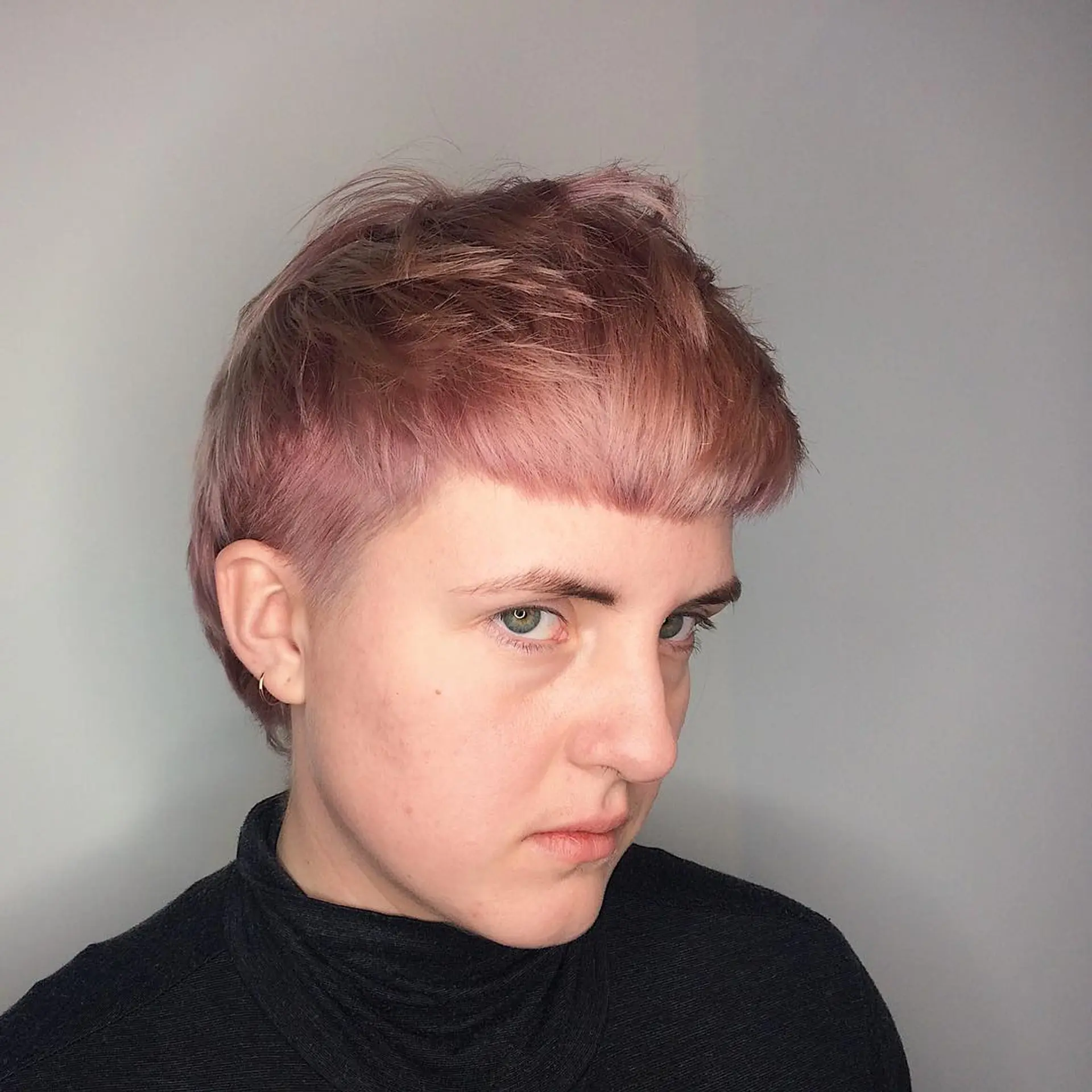 A modern shaggy mullet featuring edgy texture and a vibrant rose gold color. 2