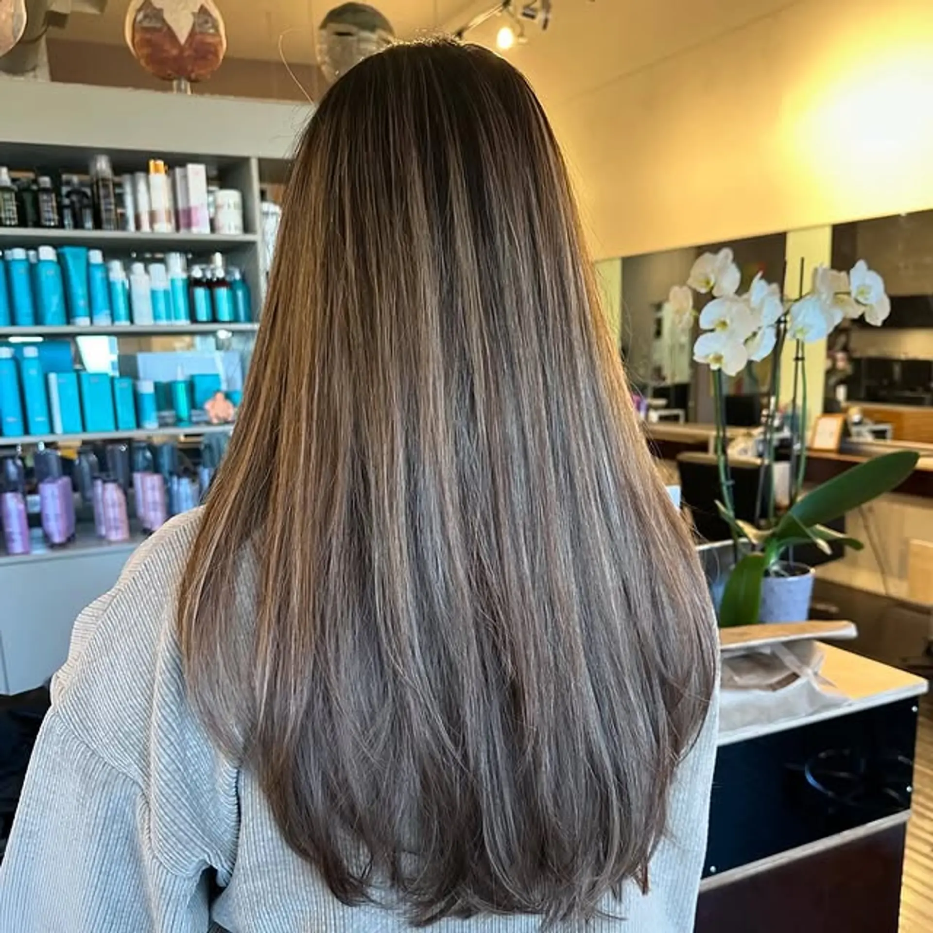 Long layered hair with a blended ash brown balayage. 1