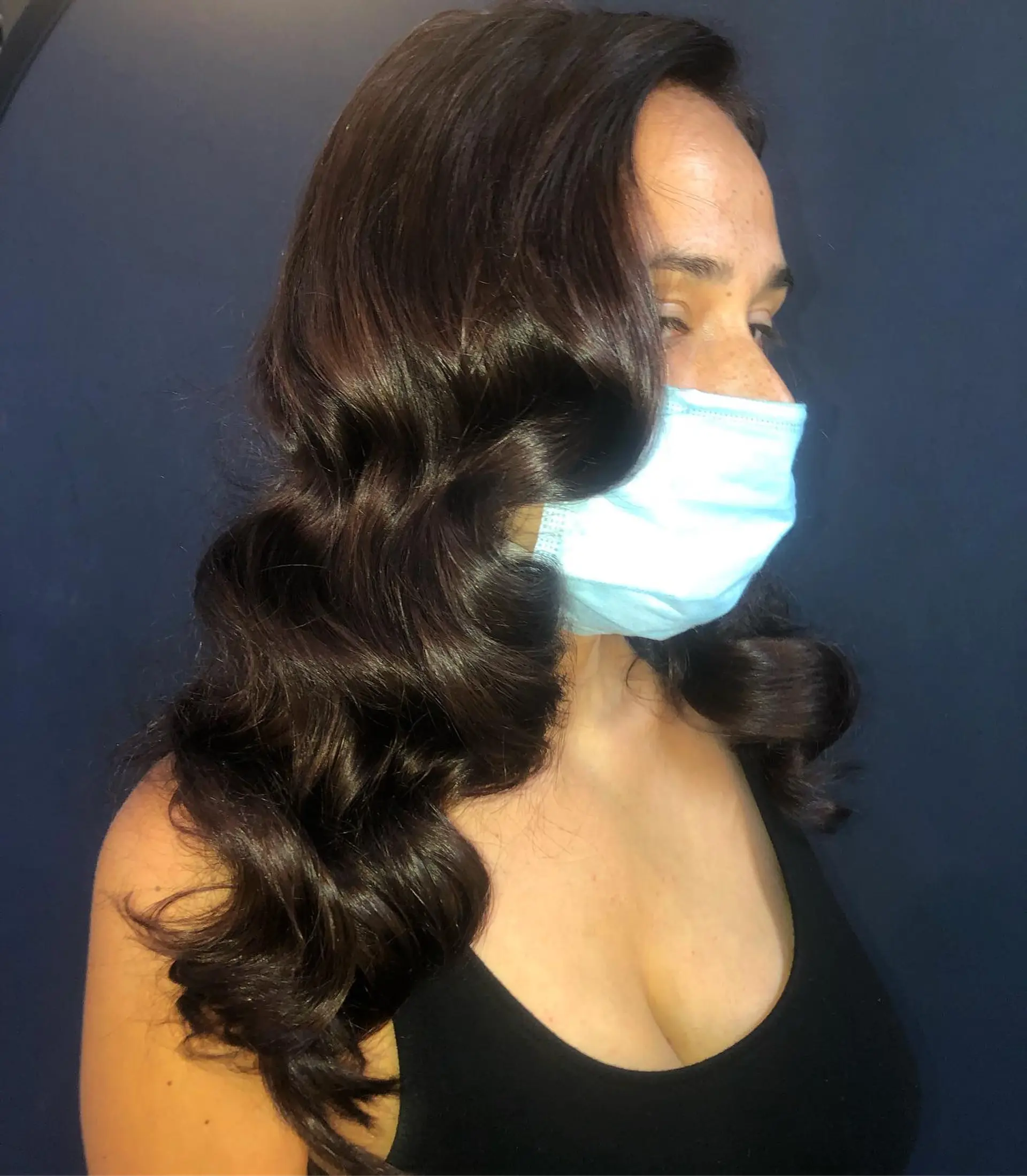 Rich, glossy dark brunette hair styled into classic, polished Hollywood waves. 1