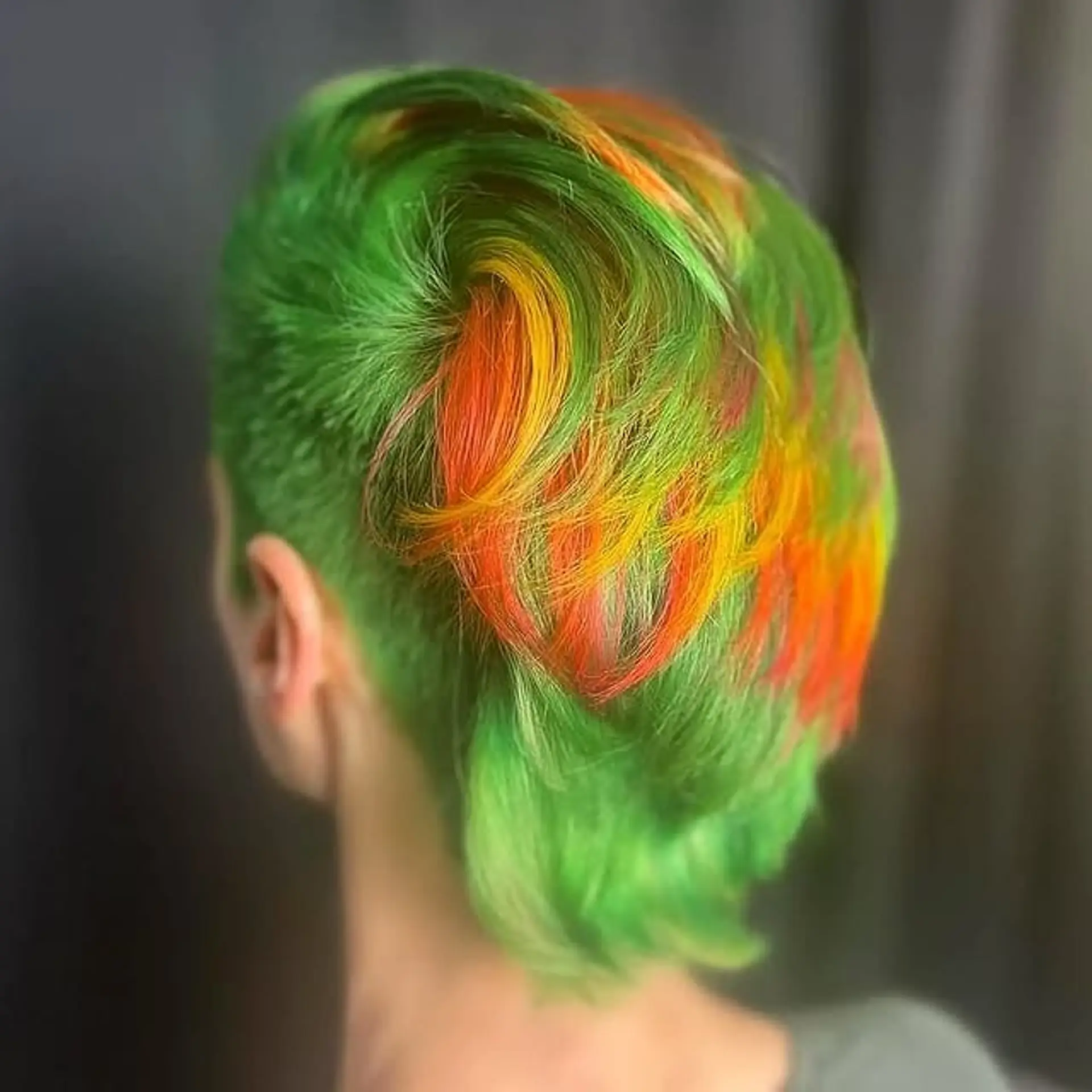 A vibrant fantasy colored mohawk with an undercut. 1