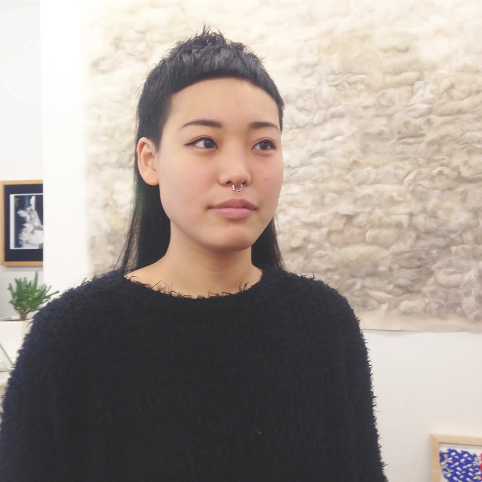 An eye-catching modern hairstyle featuring a stark undercut that contrasts with longer straight black hair. The top section is styled into an edgy, angular fringe, blending seamlessly into longer layers that descend past the shoulders. Green line💚🤑🌵 1