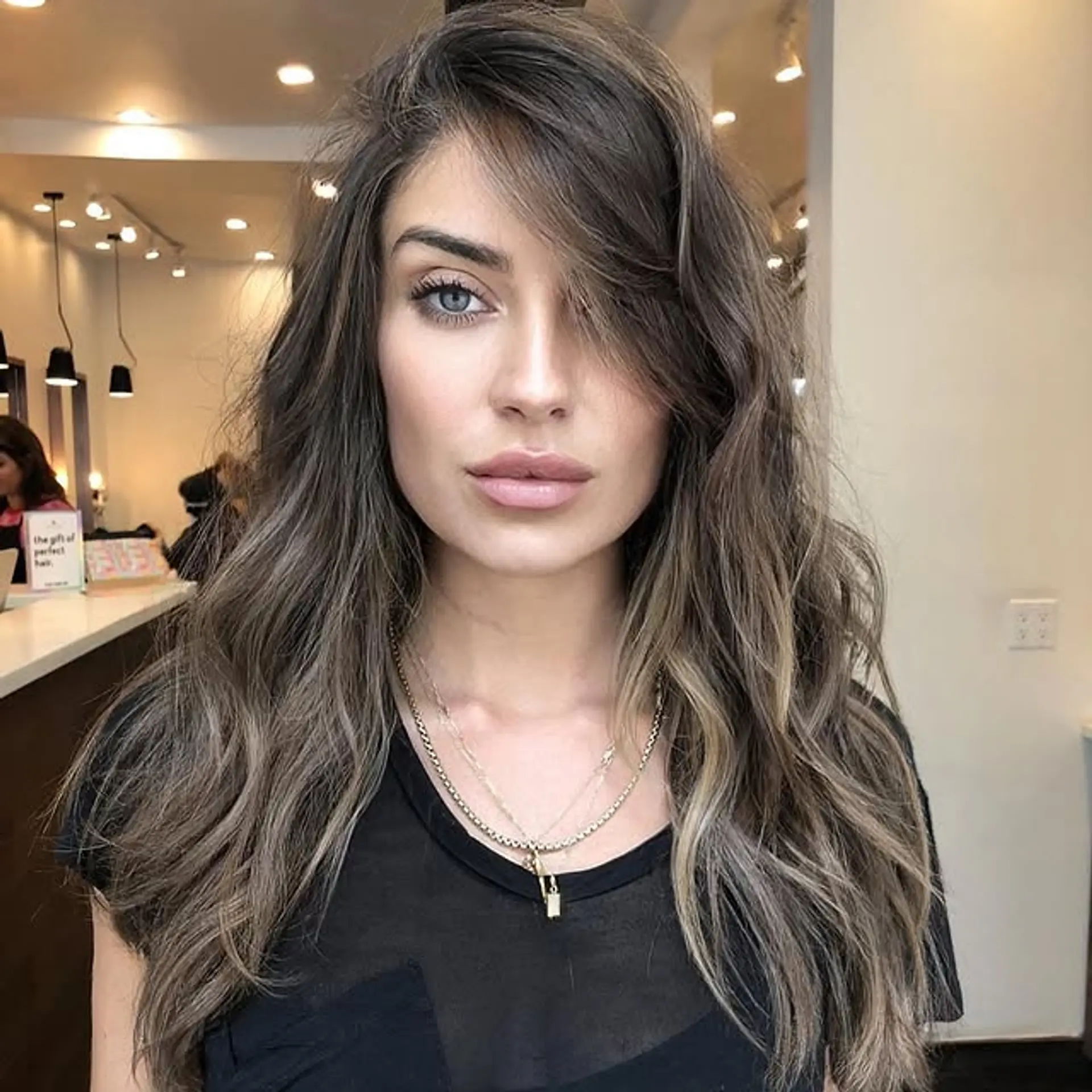 Long, wavy bronde hairstyle with face-framing layers. 1