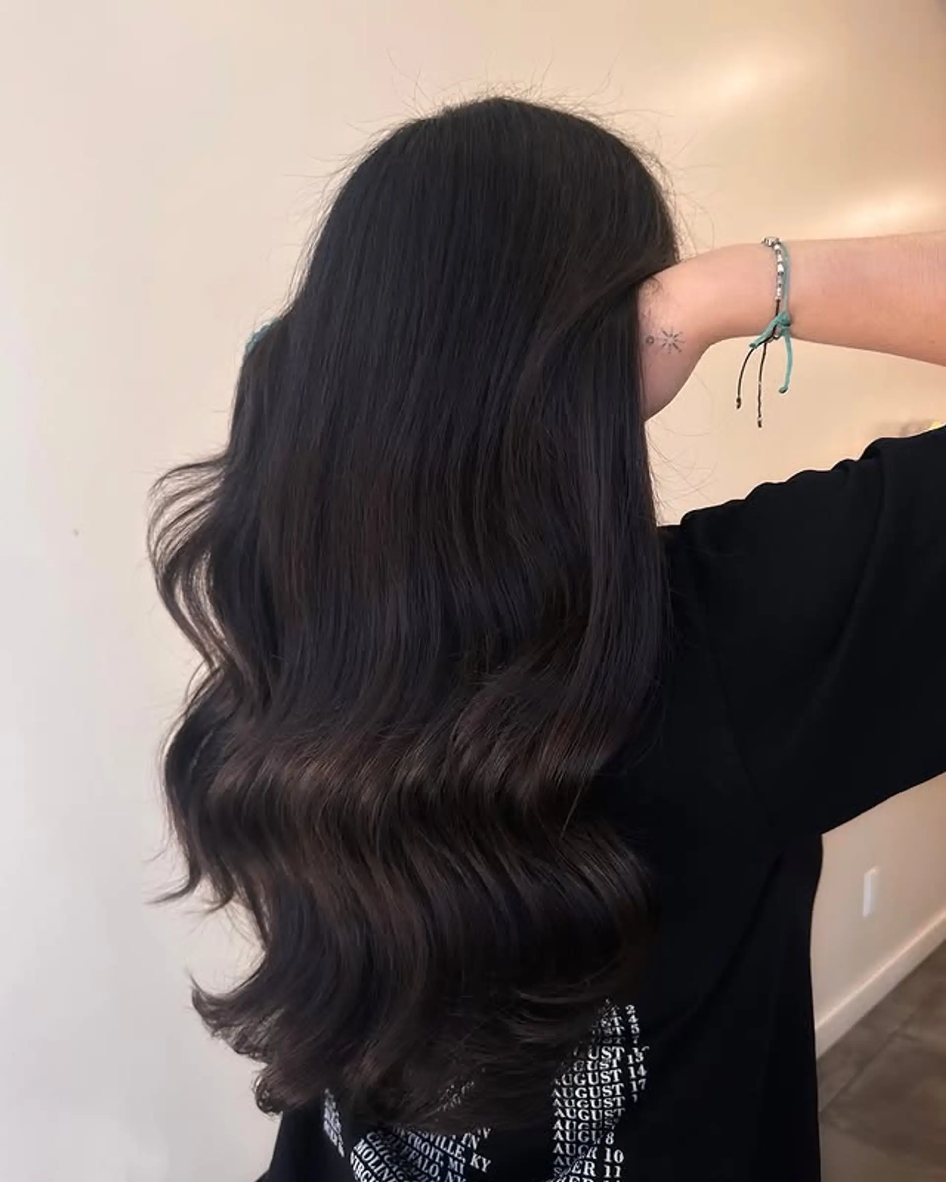 Long, layered brunette hair with soft waves. 1