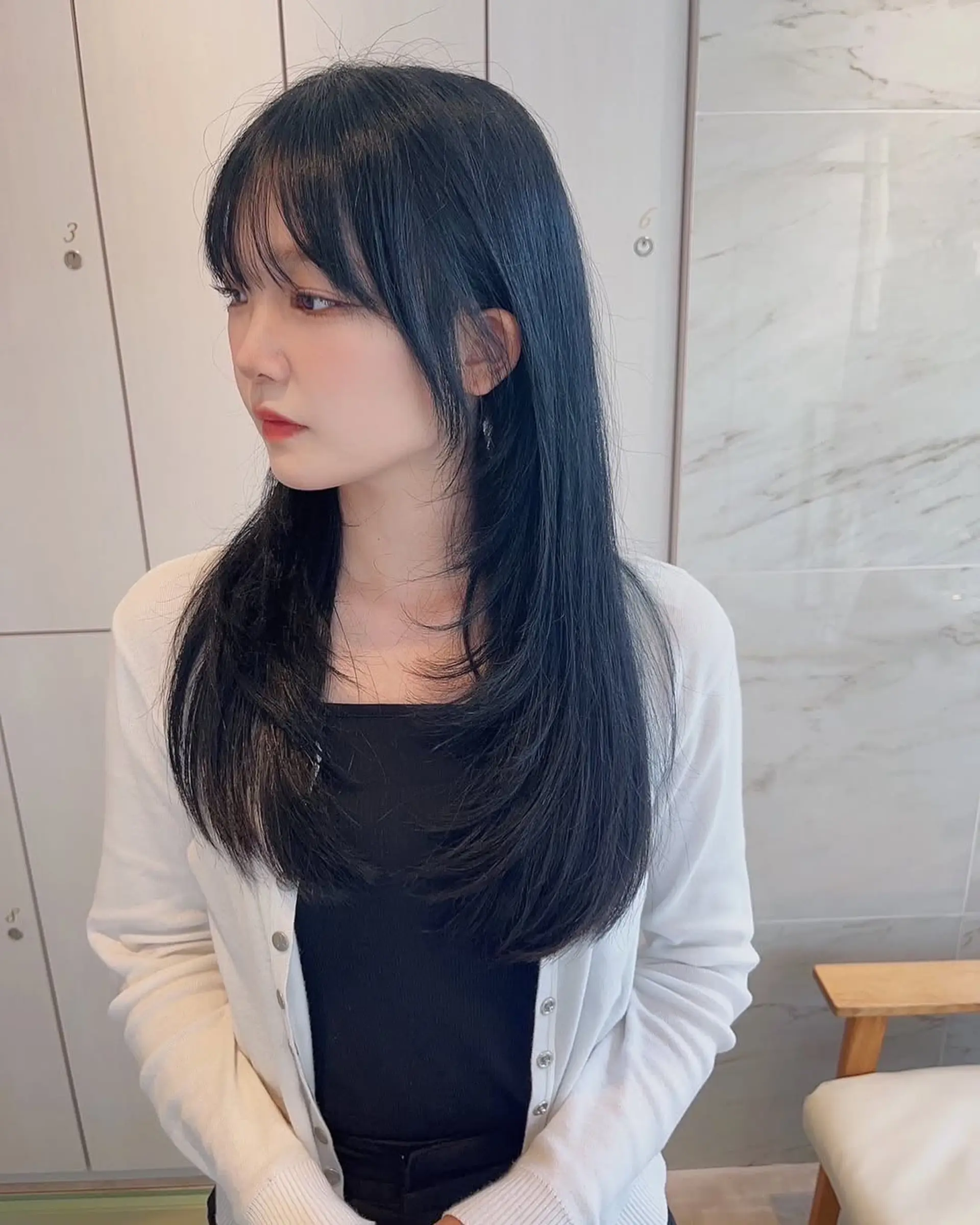A long layered cut with trendy see-through bangs. 1