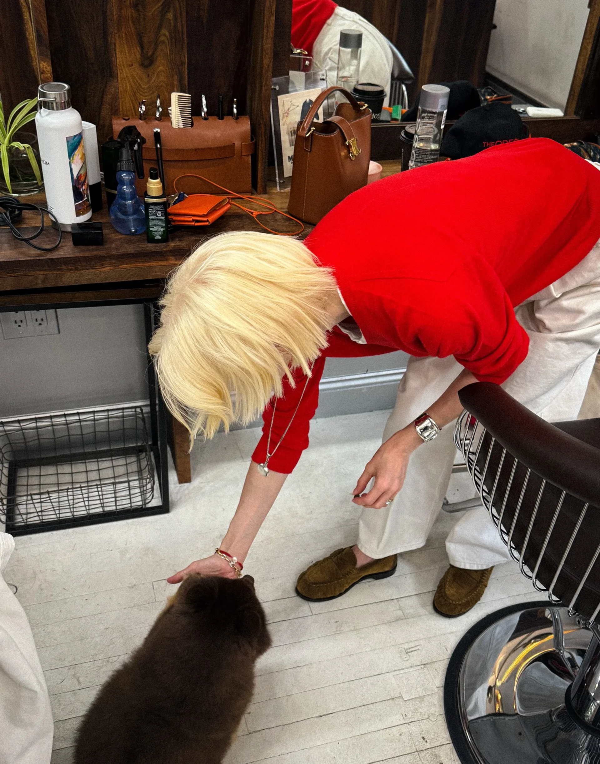 A woman with very long, wavy platinum blonde hair with a silver hue and shimmering shine, demonstrating the Chrome Blonde trend. - Preview 1