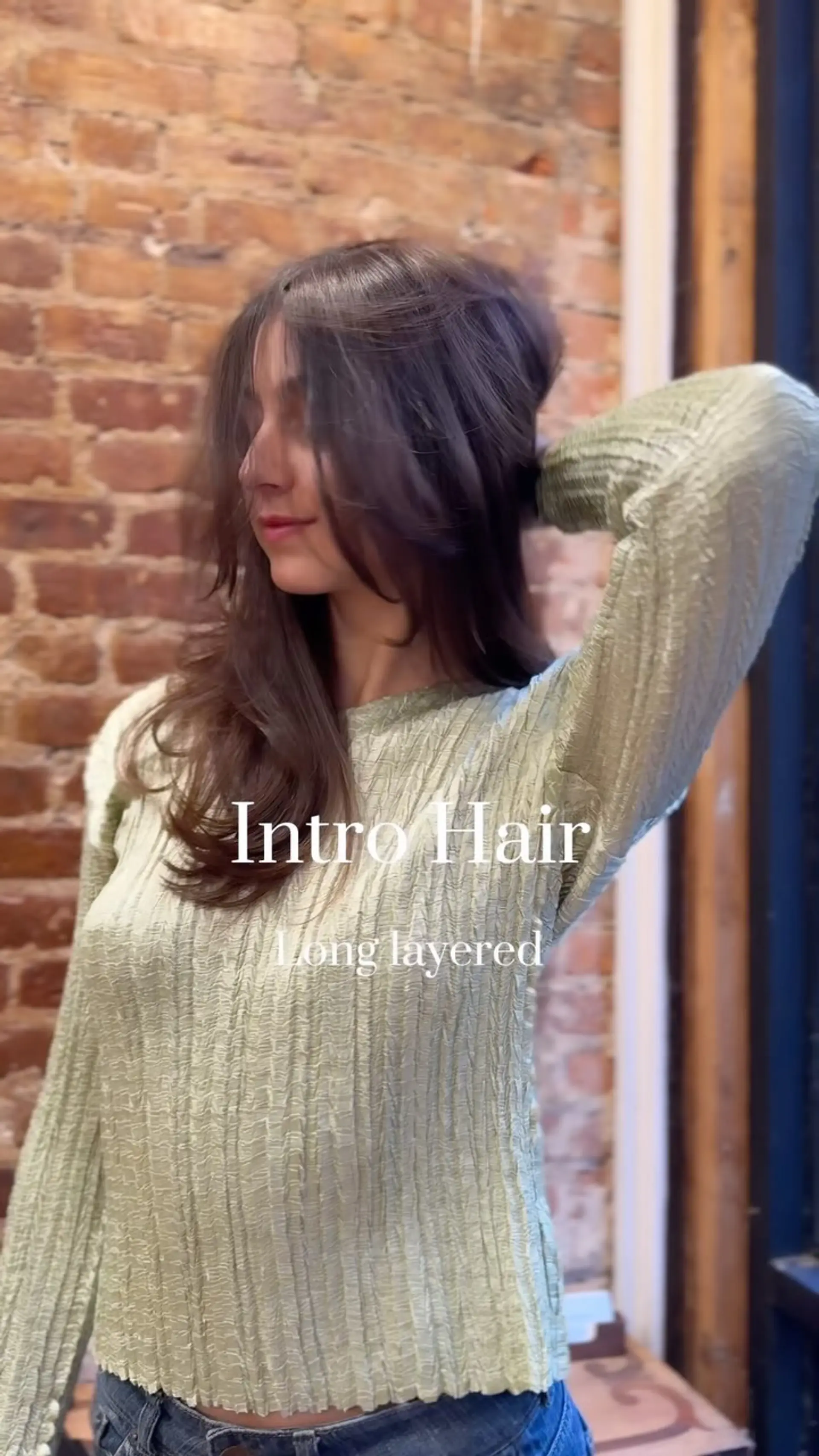 Long brown hair cut in cascading layers with soft, face-framing fringe styled in a voluminous blowout. 1