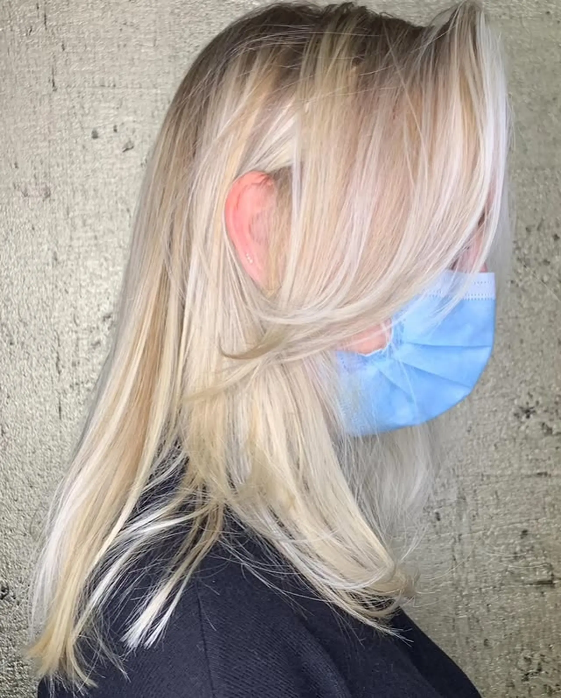 Layered medium length hair with face-framing layers and soft curtain bangs. 1