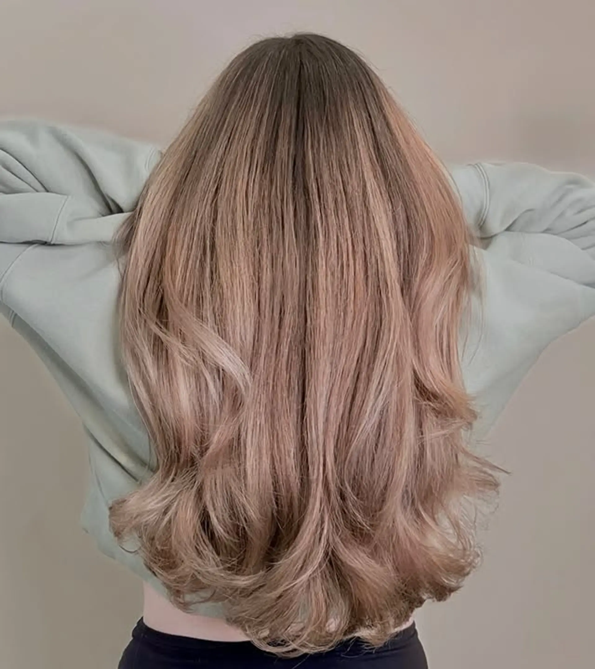 Long, straight hair with rose gold balayage and ribbon highlights. 1