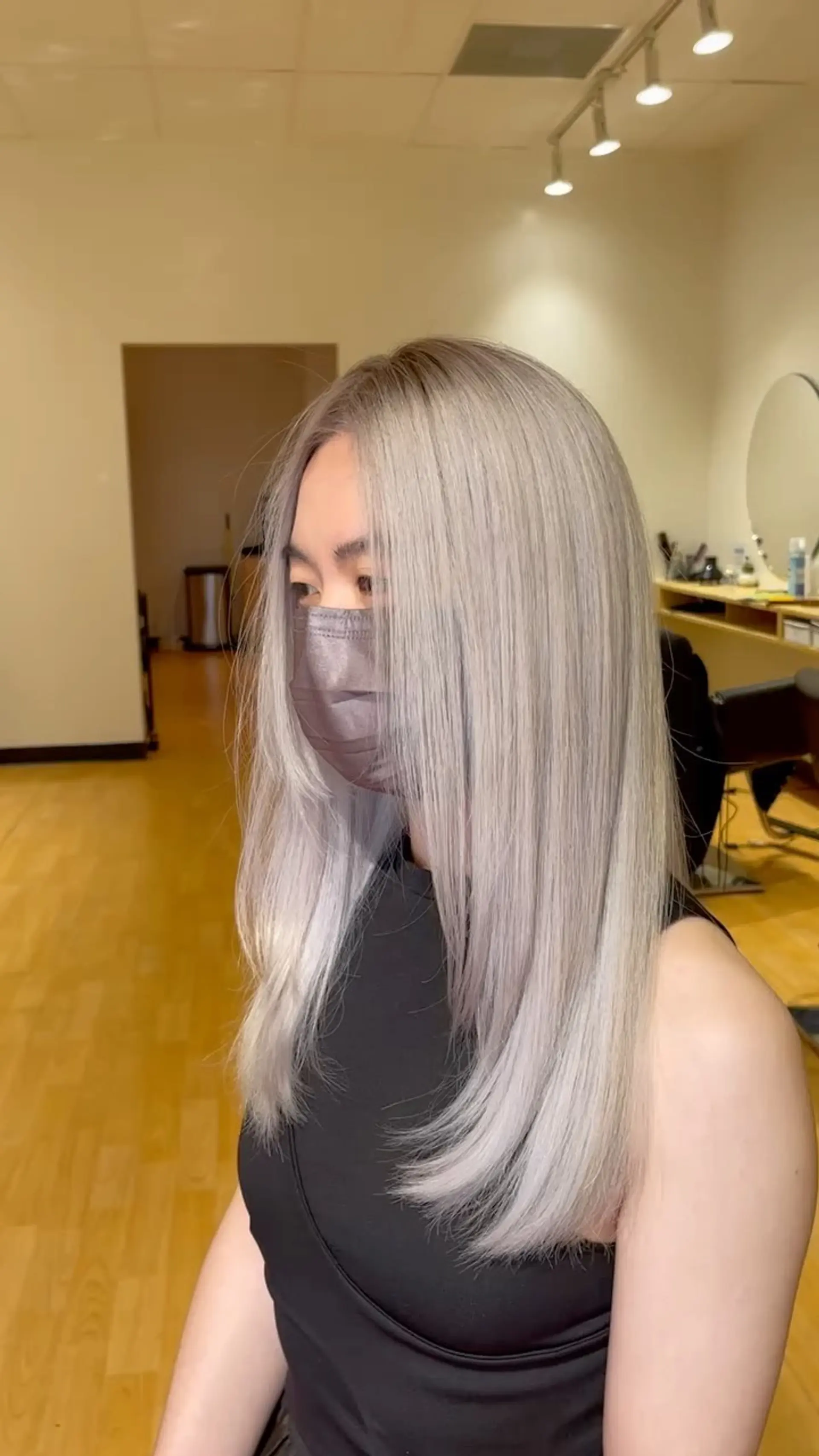 Long straight hair colored in an icy silver tone with soft face-framing layers. 1