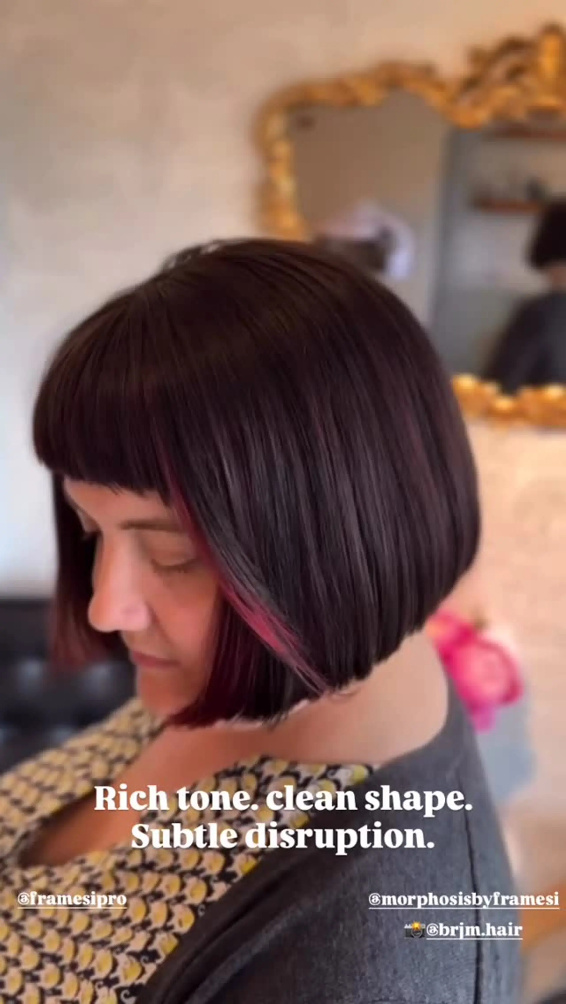 A sleek, sharp chin-length bob paired with blunt micro bangs and subtle pink peekaboo accent highlights. 1