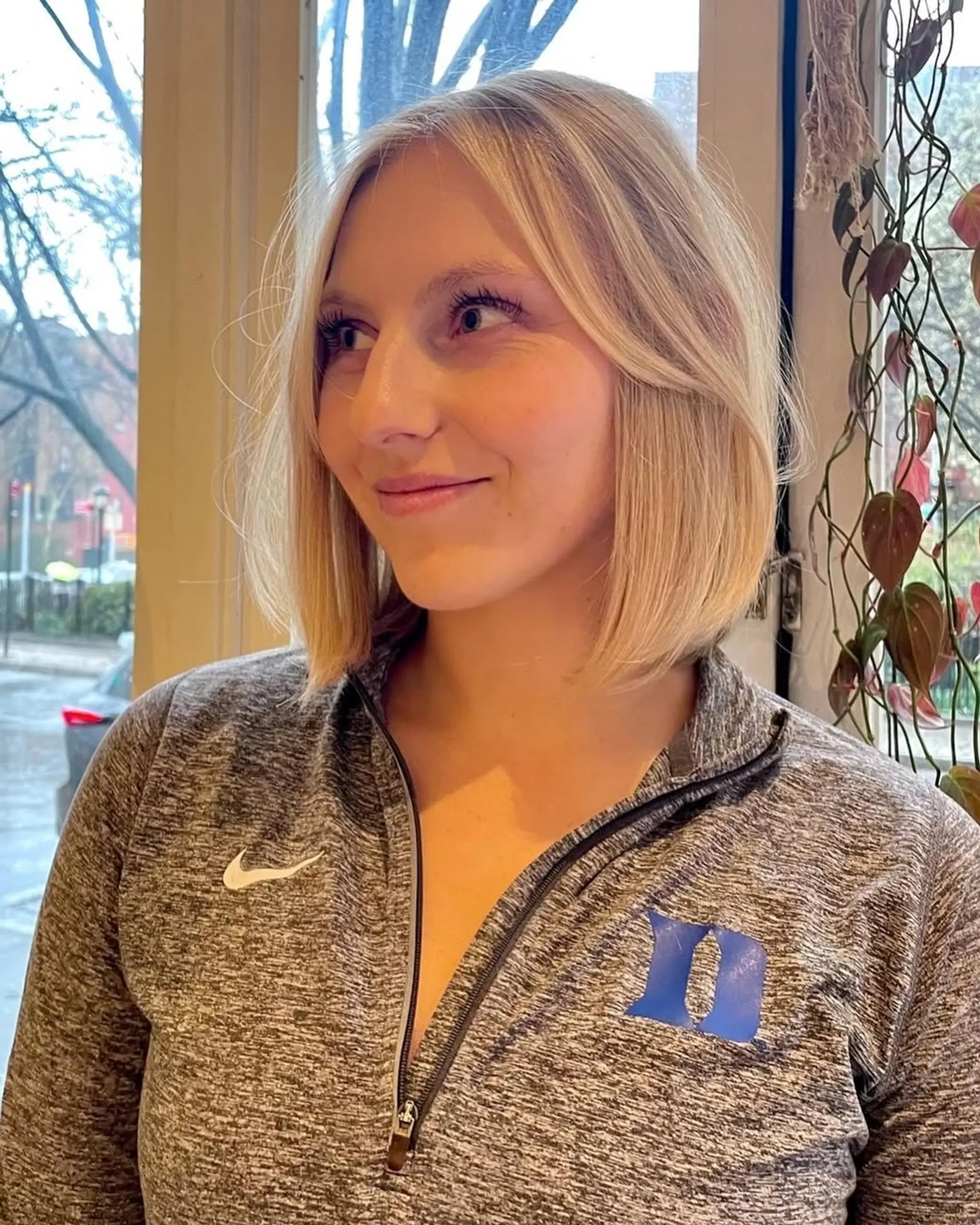 A chic blunt bob with subtle face-framing layers for a modern and sophisticated look. 2