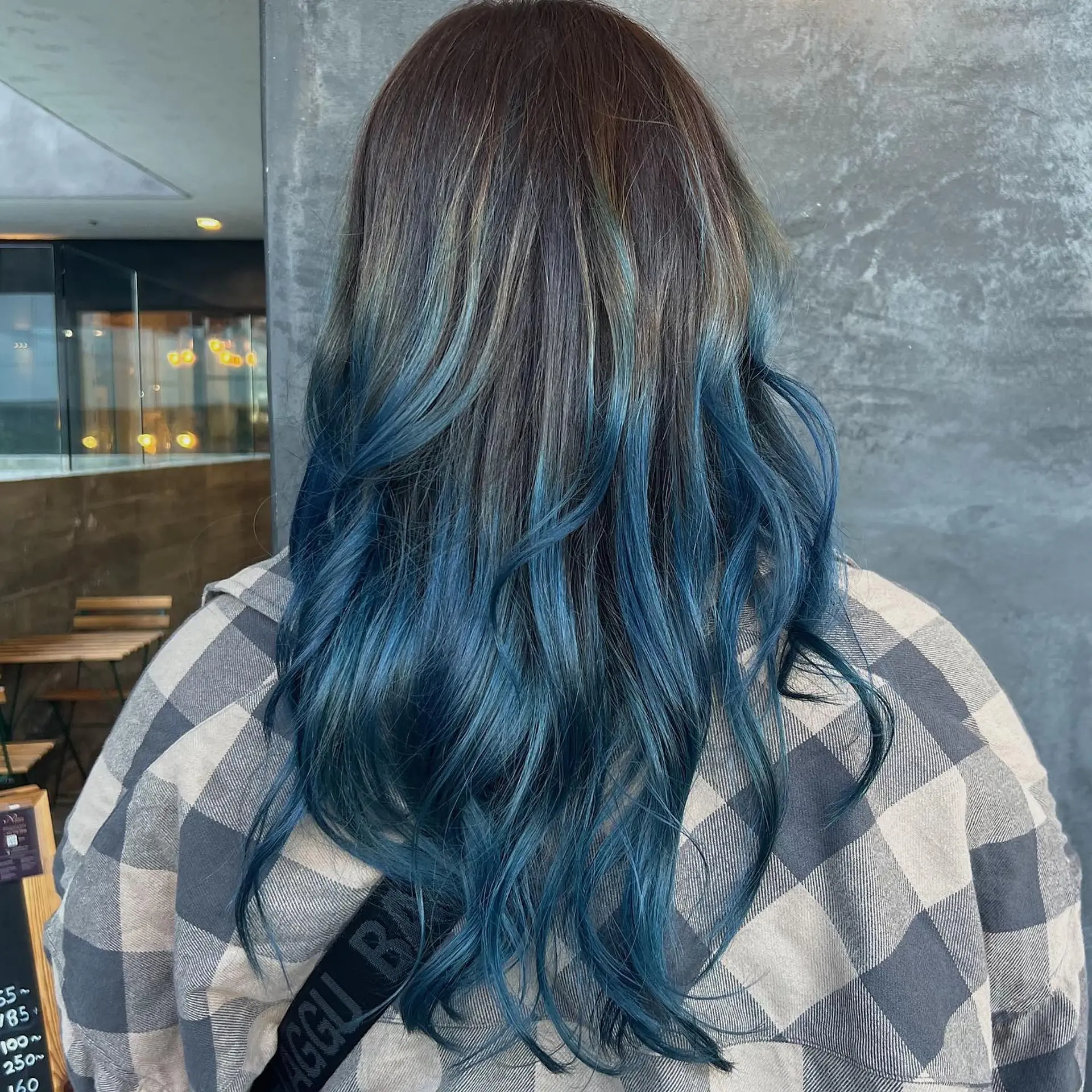 Long layered hair featuring an ombre color melt. 1