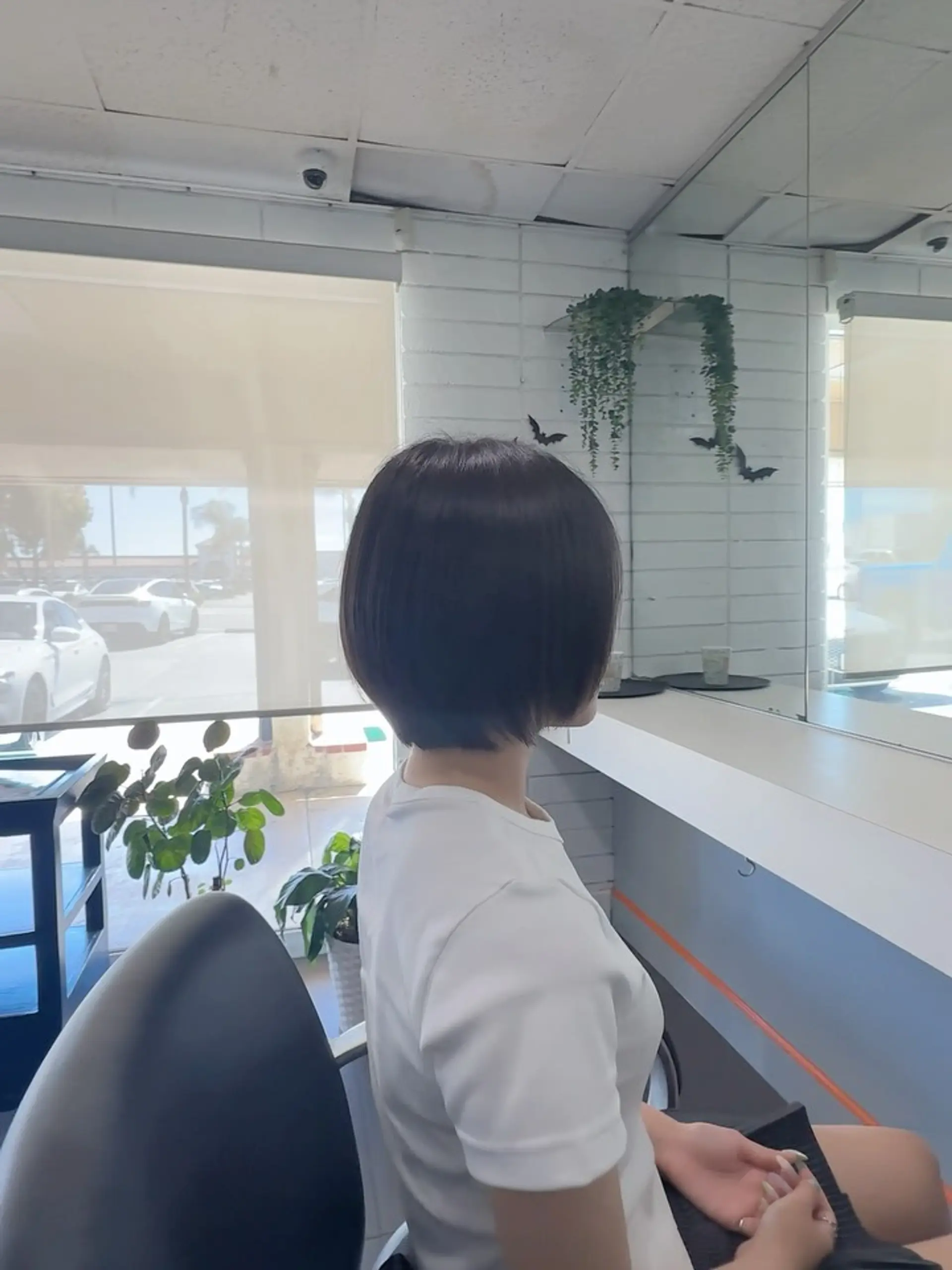 A chic, soft rounded bob haircut with subtle layers and a tapered neckline. 1