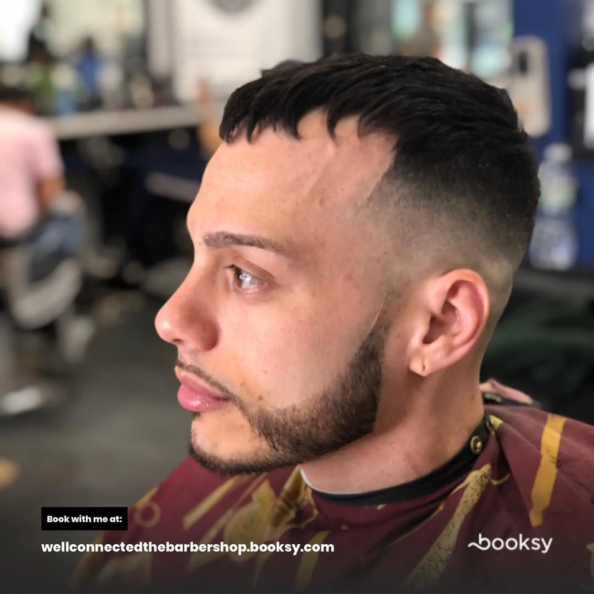 A textured crop on top styled forward with a high skin fade on the sides and back, complemented by a neatly defined beard line-up. 1
