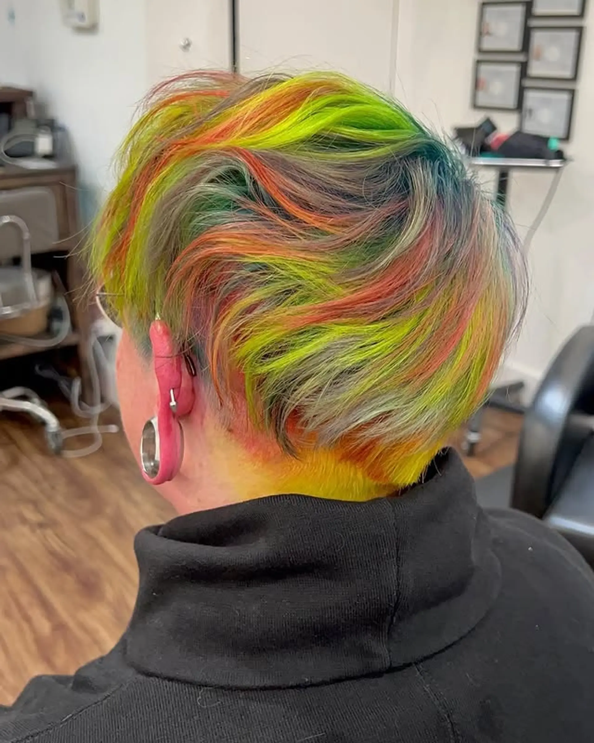 A dynamic pixie cut with a stunning rainbow color melt. 1