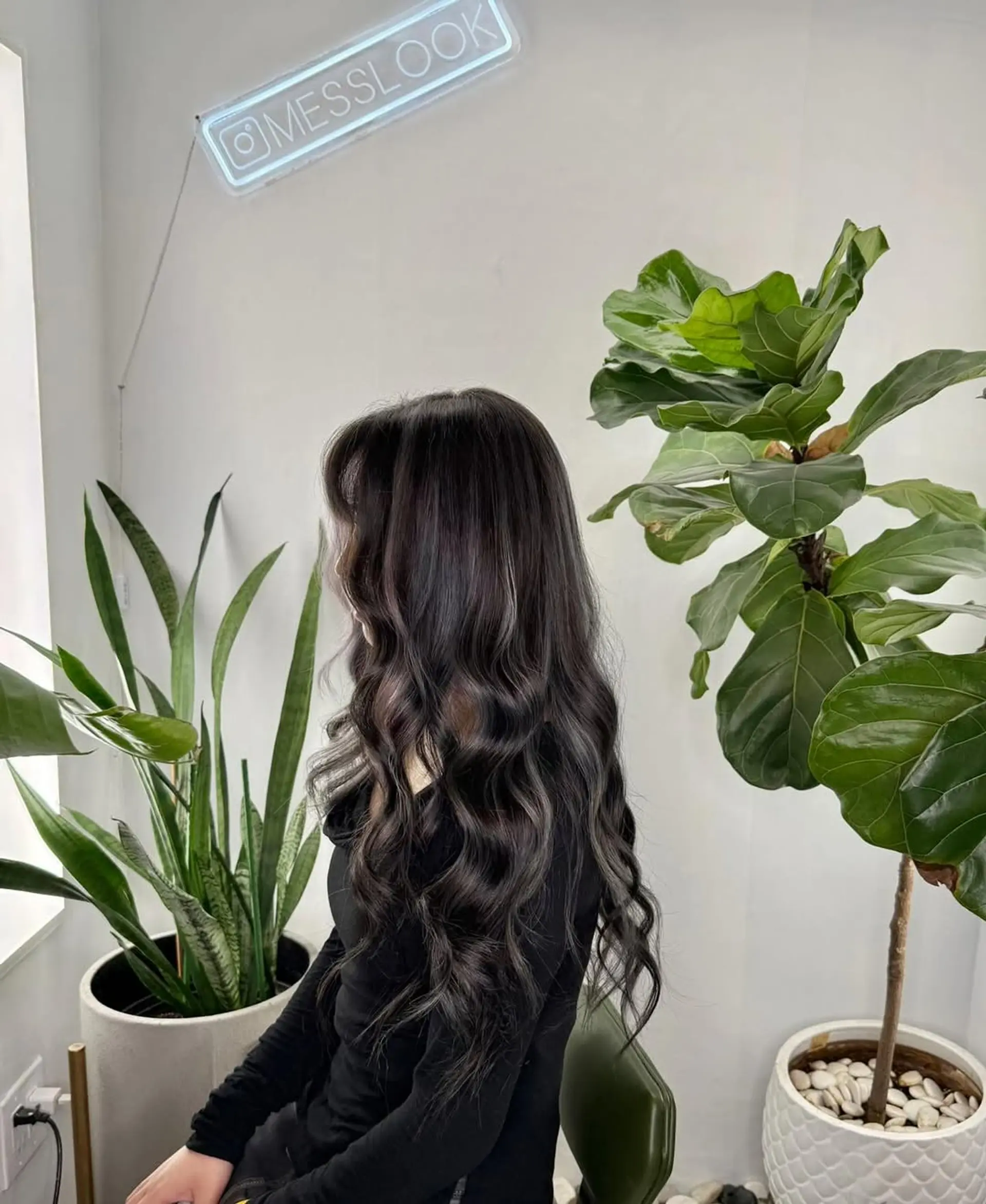 Long hair styled into soft, loose, cascading waves that provide natural-looking volume and depth, enhanced by subtle highlights. 1
