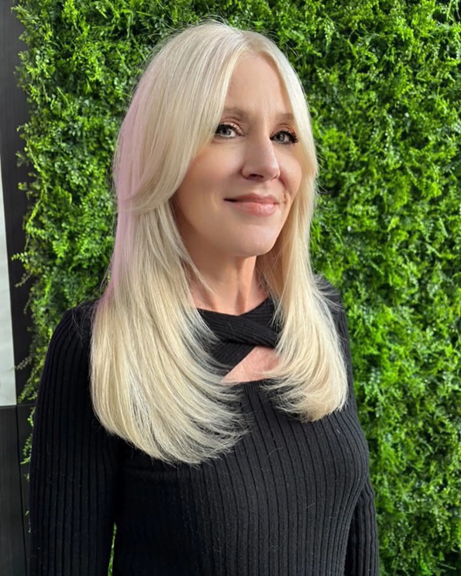 A long layered cut with face-framing curtain bangs. 1