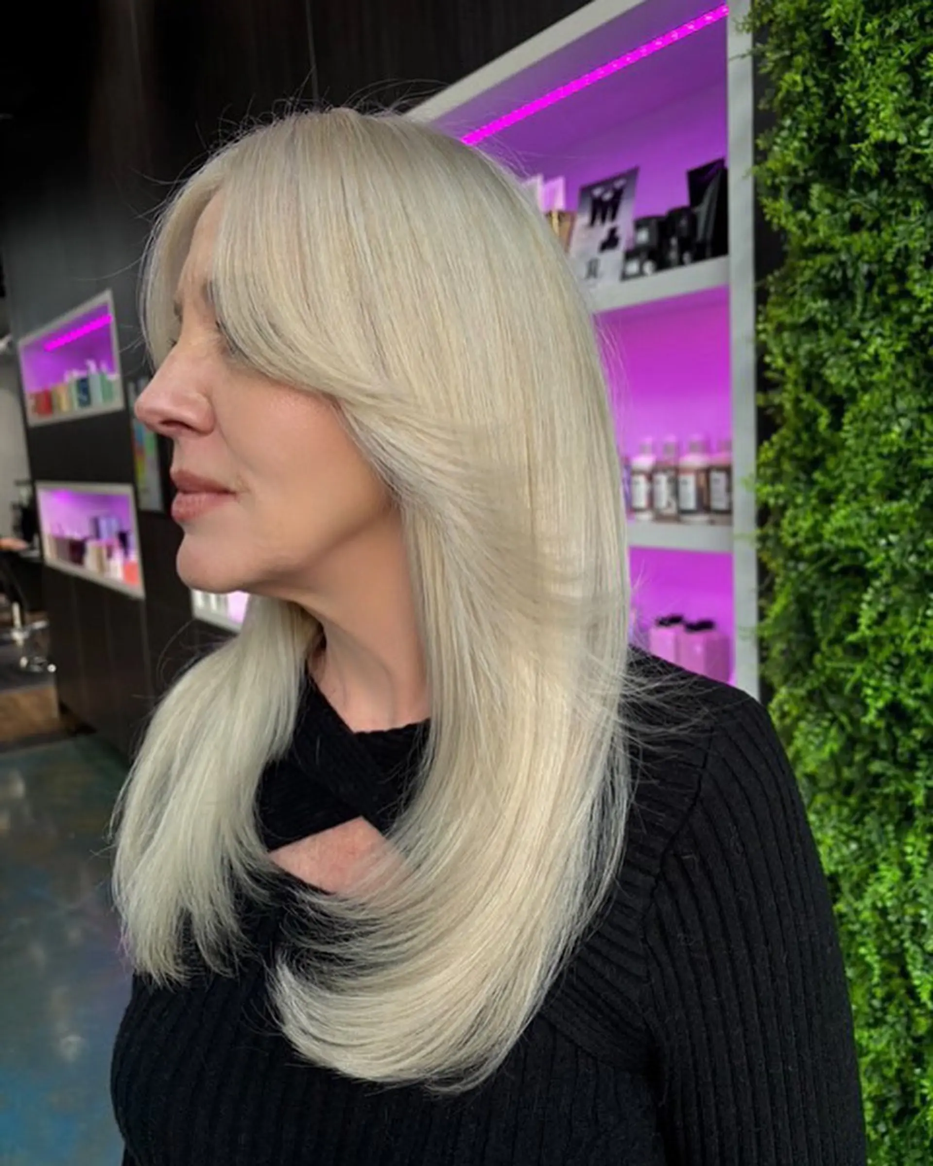 A long layered cut with face-framing curtain bangs. 2