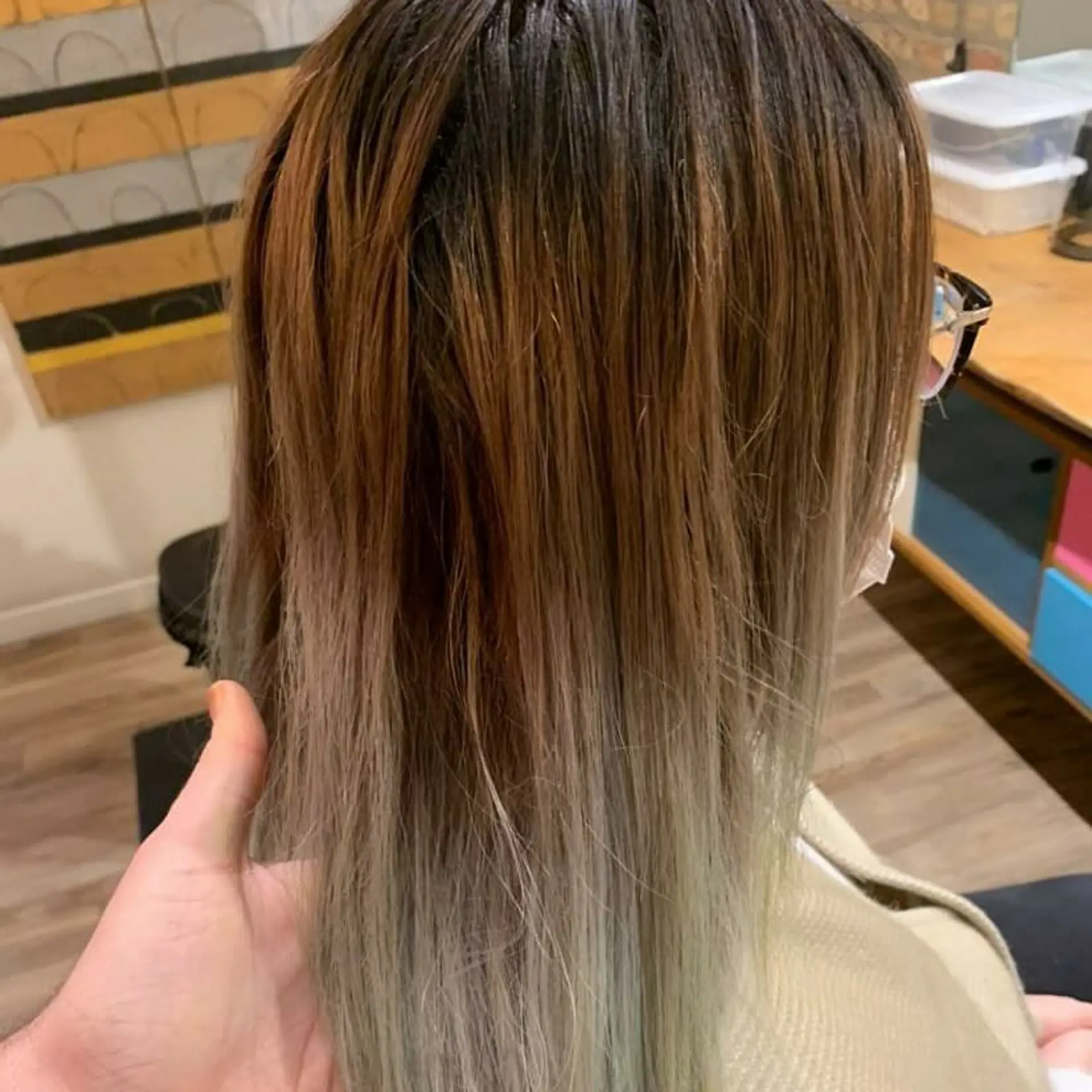 A vivid ombre style that fades from dark roots to electric blue tips. 2