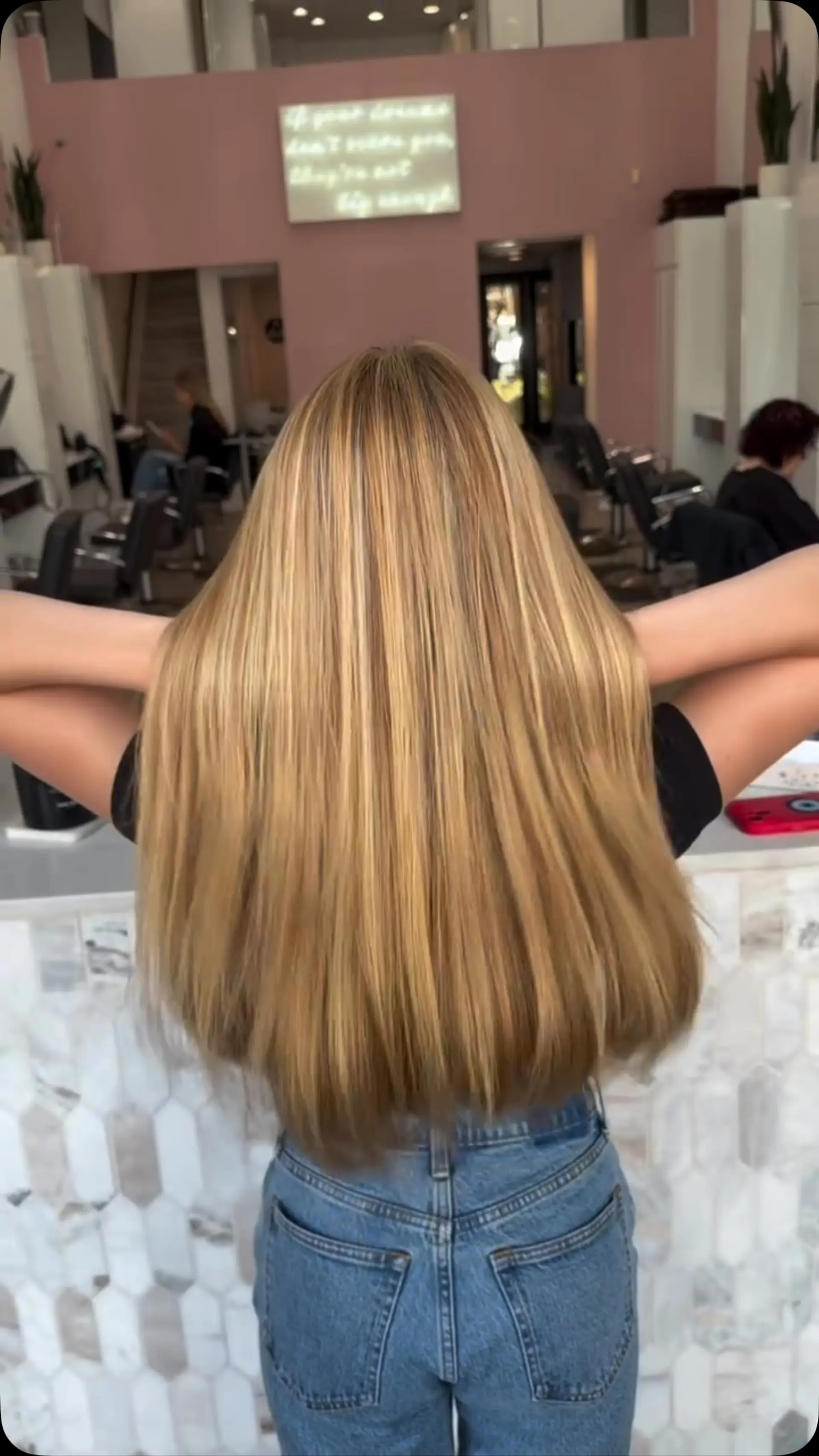 Extra-long, straight hair enhanced with warm golden blonde highlights blended throughout. 1