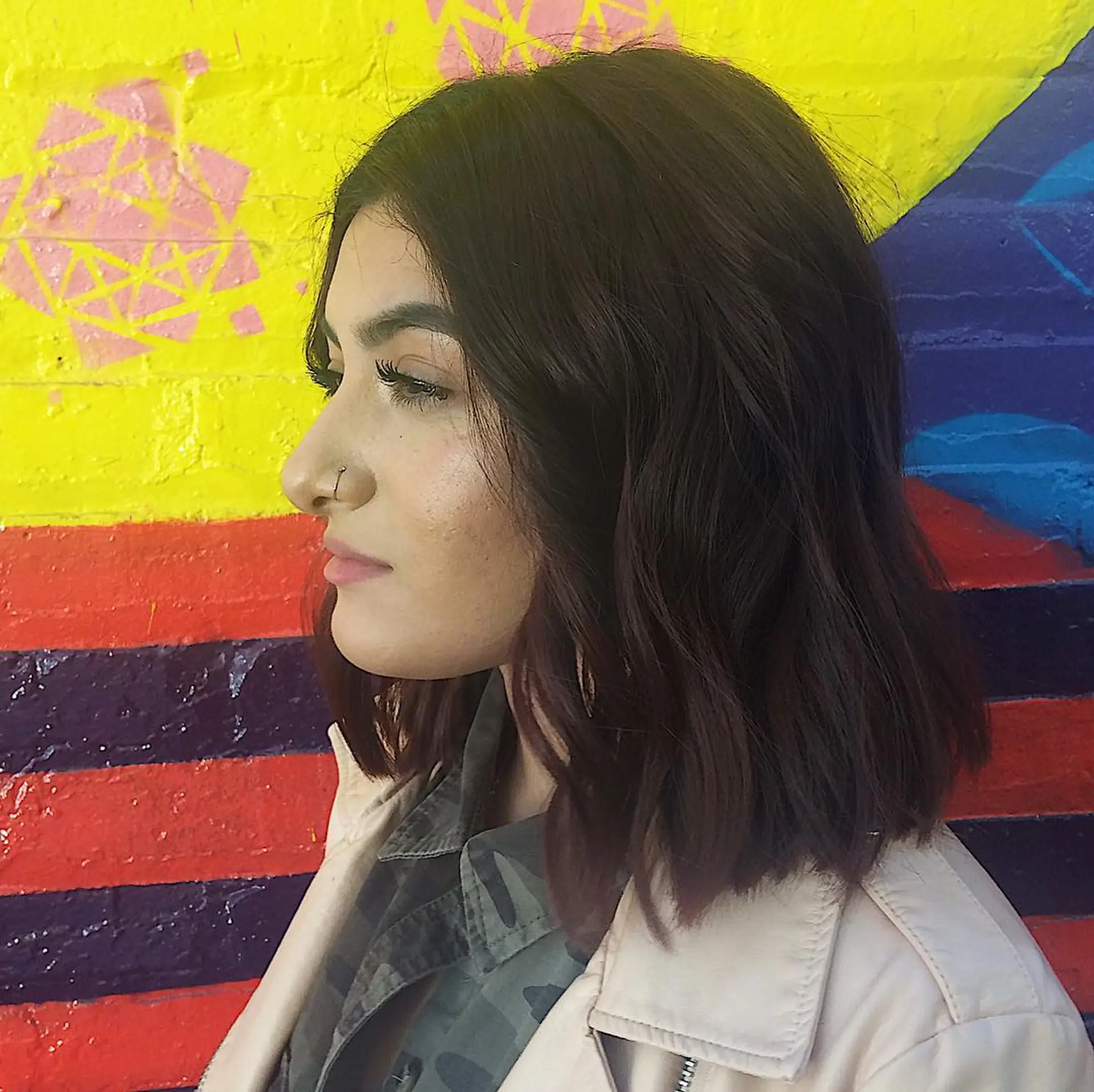 A medium-length wavy bob with subtle layers for added movement and texture. 1