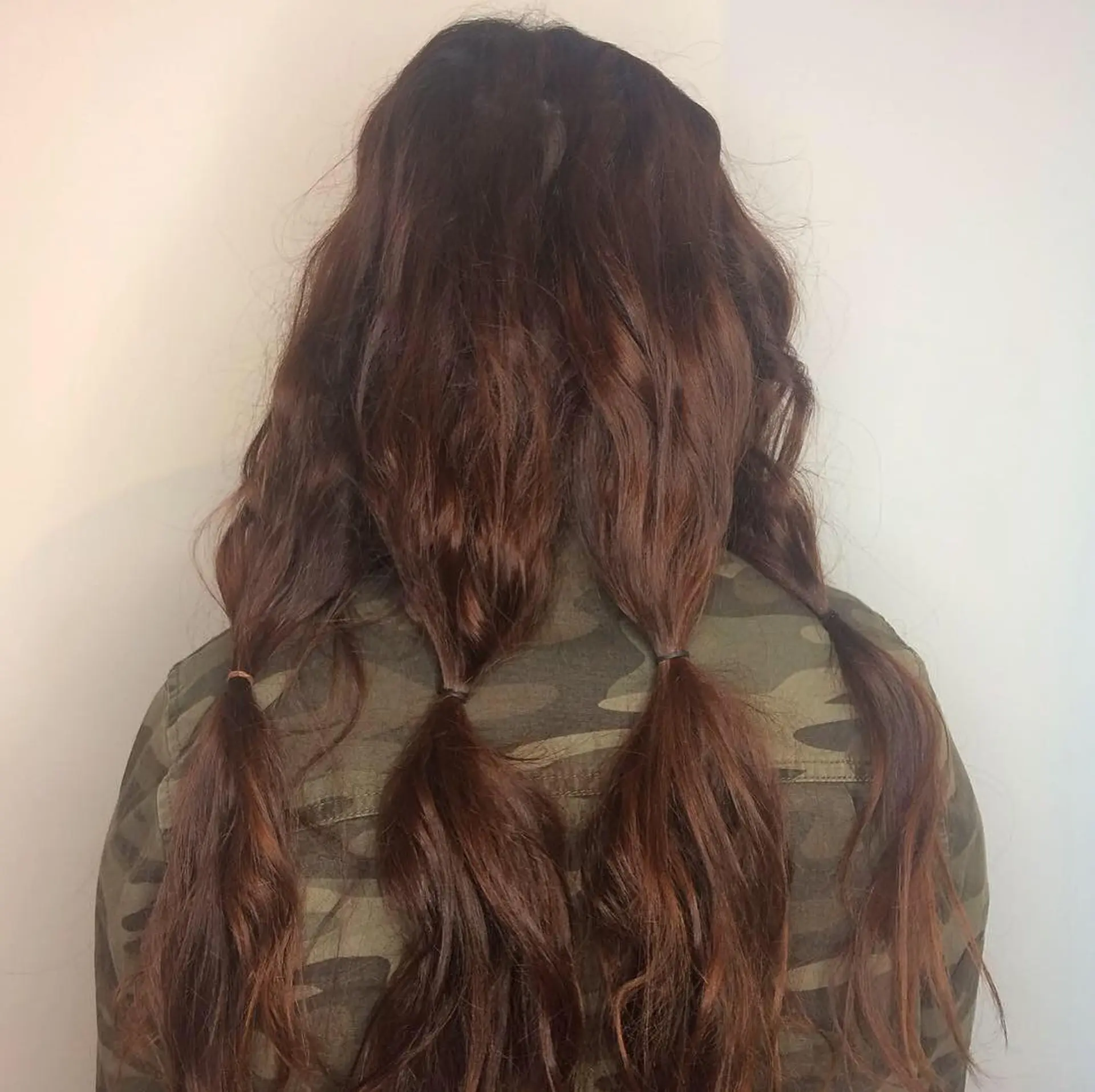 A medium-length wavy bob with subtle layers for added movement and texture. 3