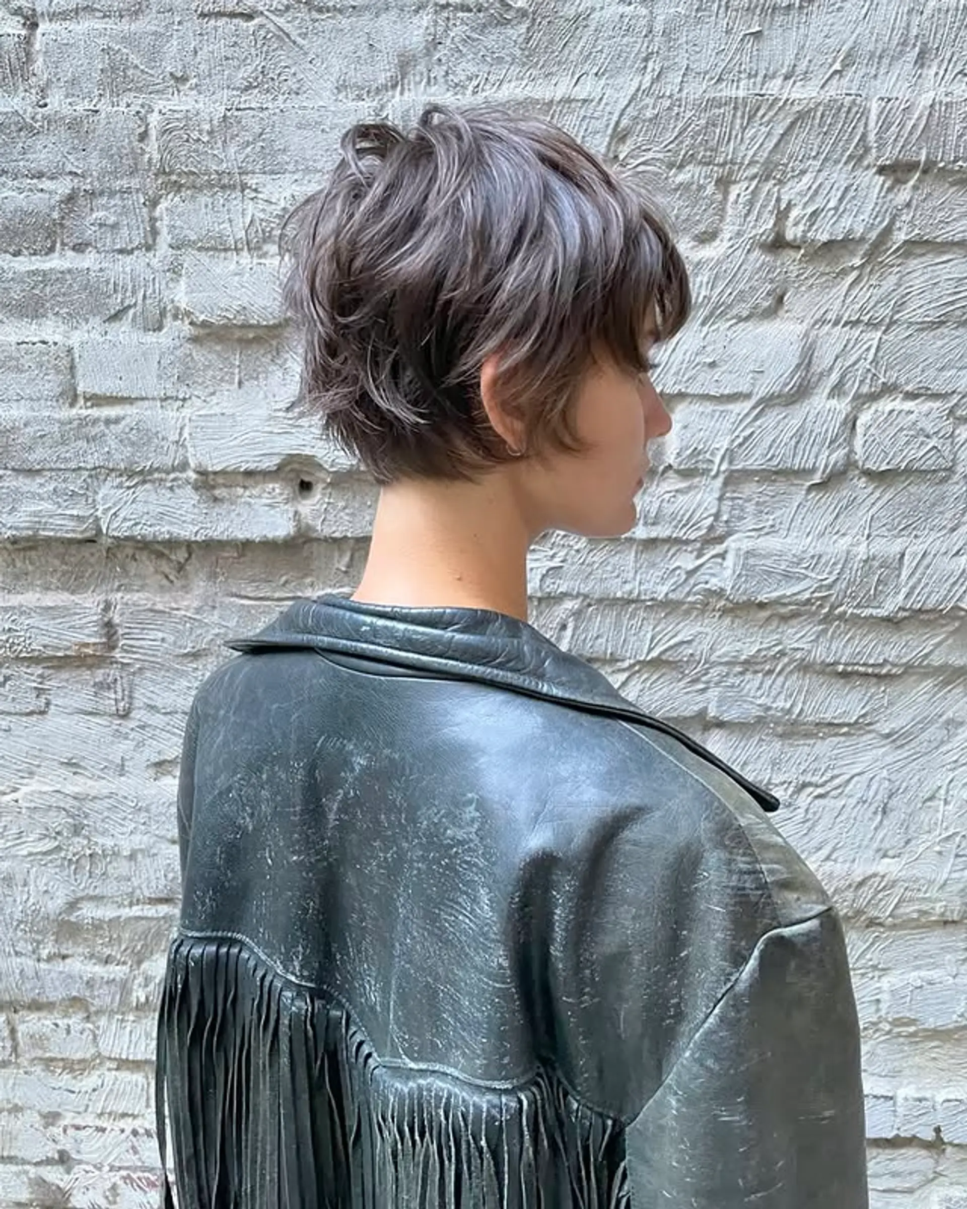 A textured pixie cut with layered styling. 1