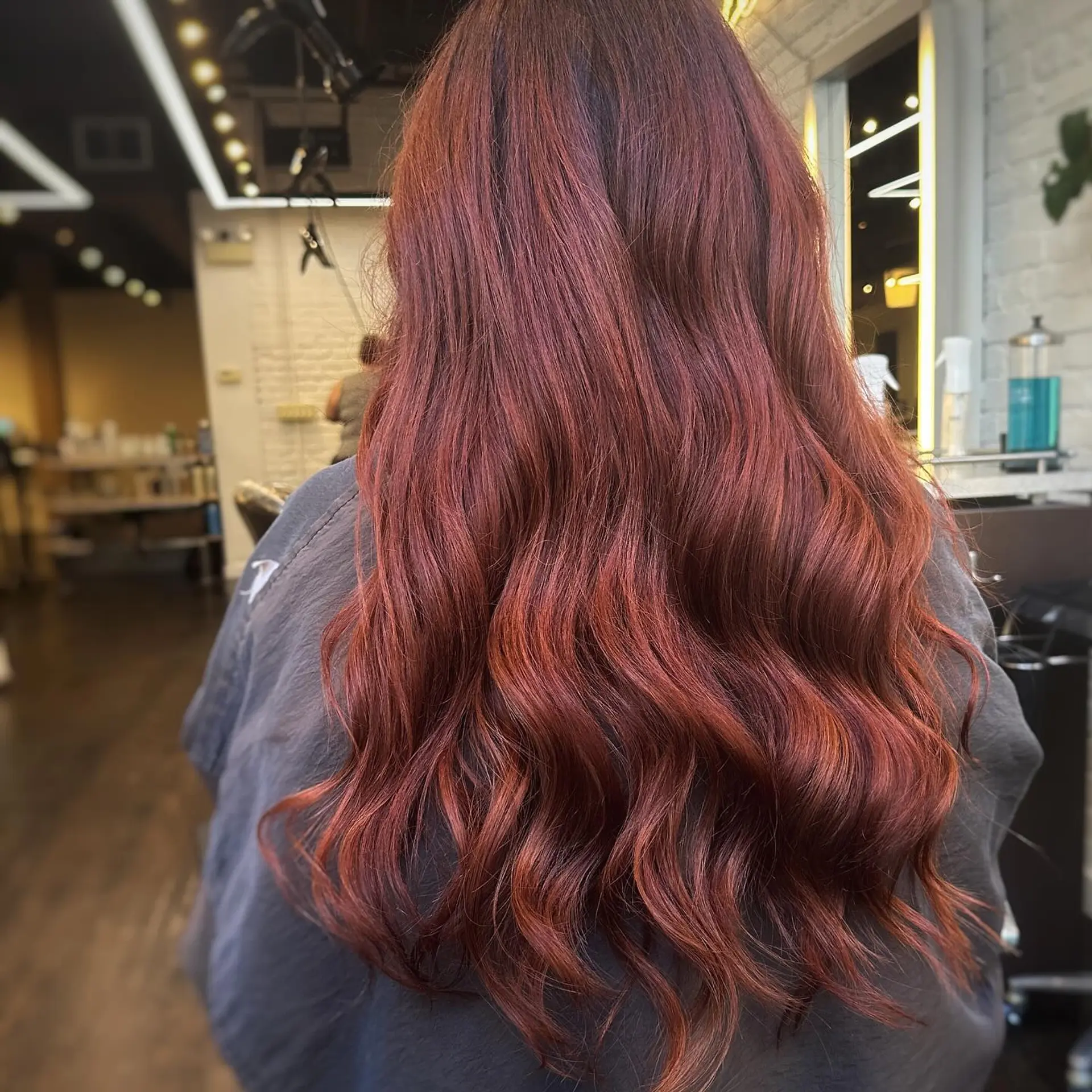 Long, wavy hair with a copper red color. 1