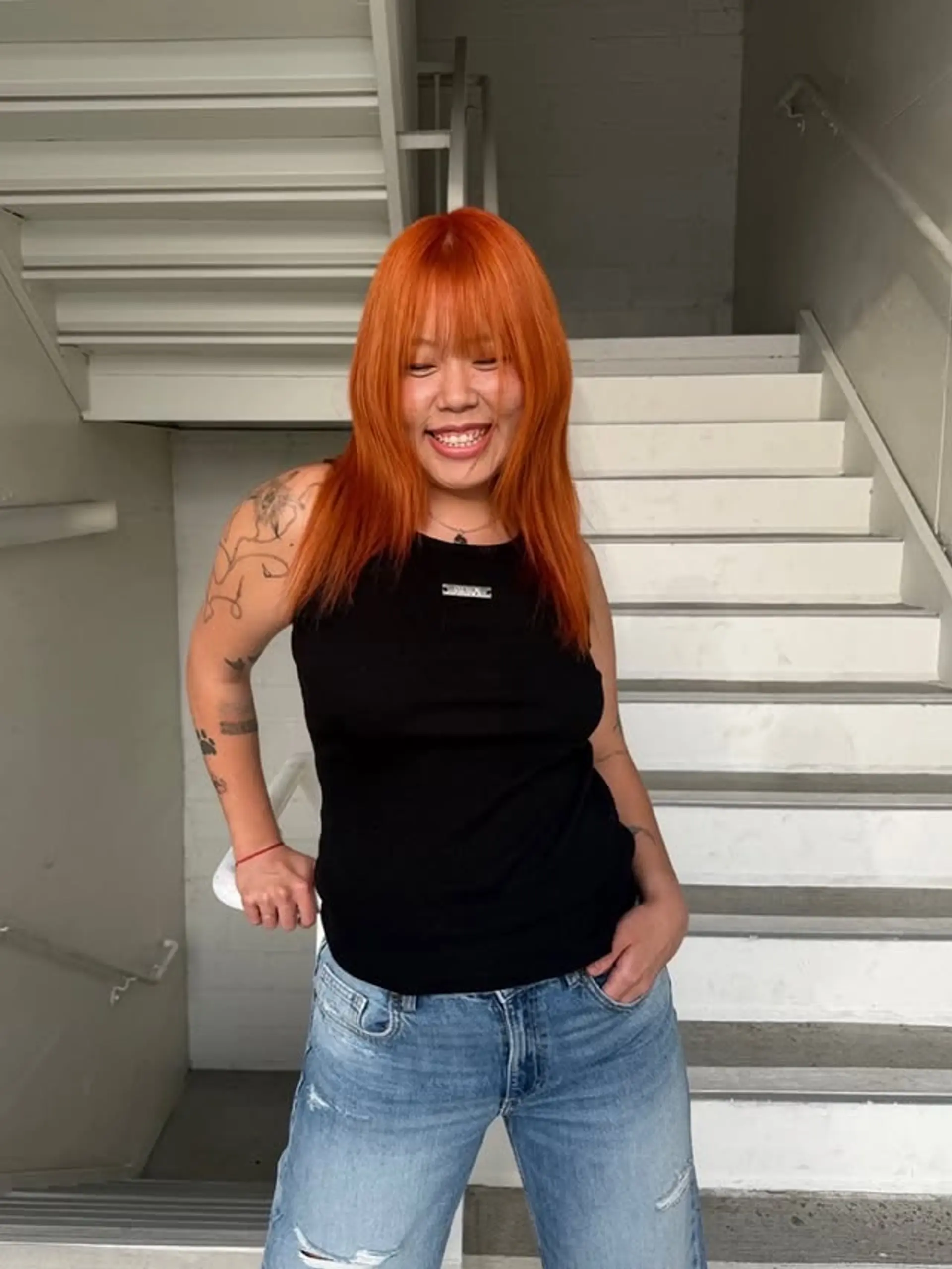 A trendy, medium-length shag with layered texture and bold bangs. 1