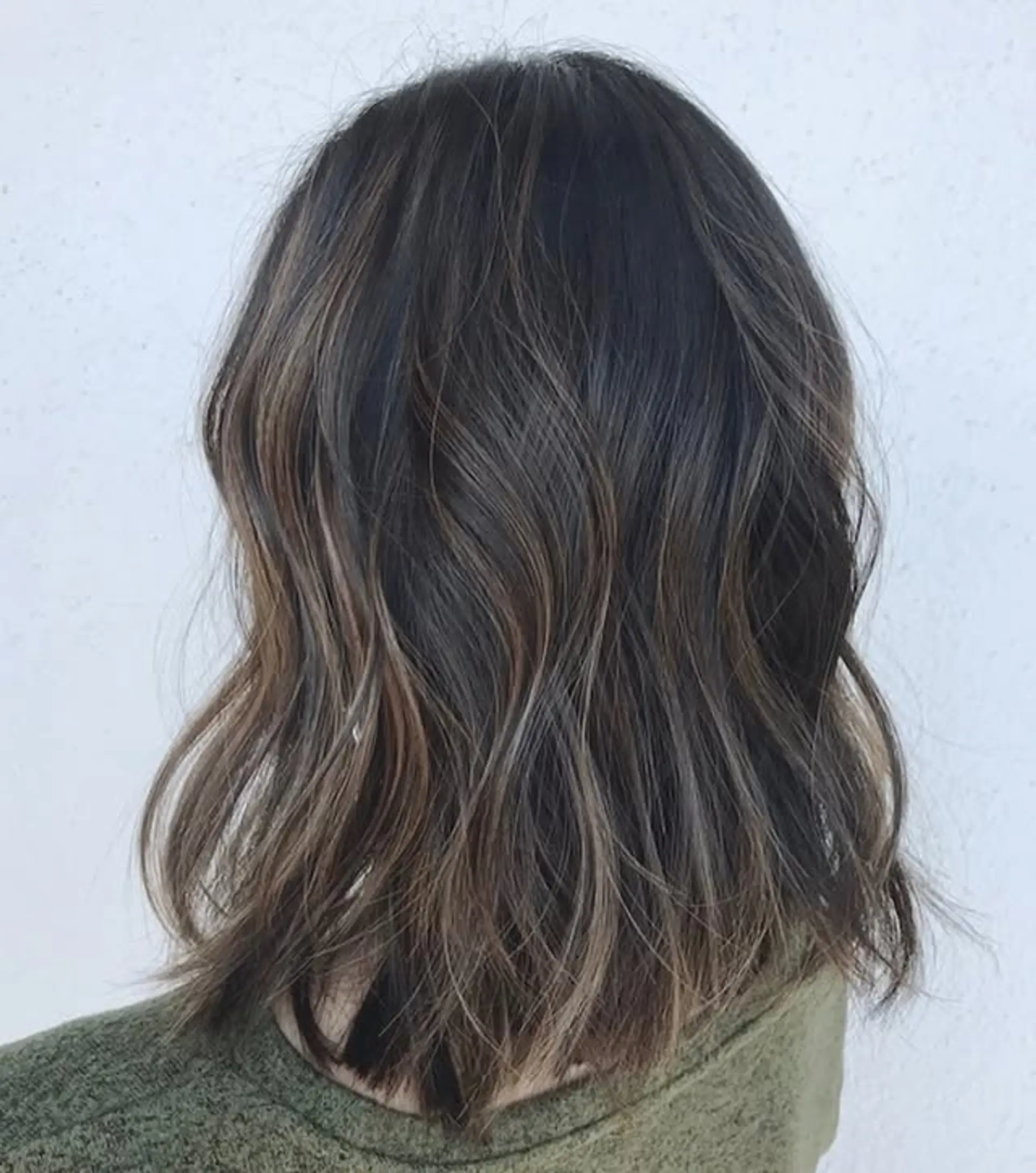 A medium-length wavy bob with a chocolate swirl balayage. 1