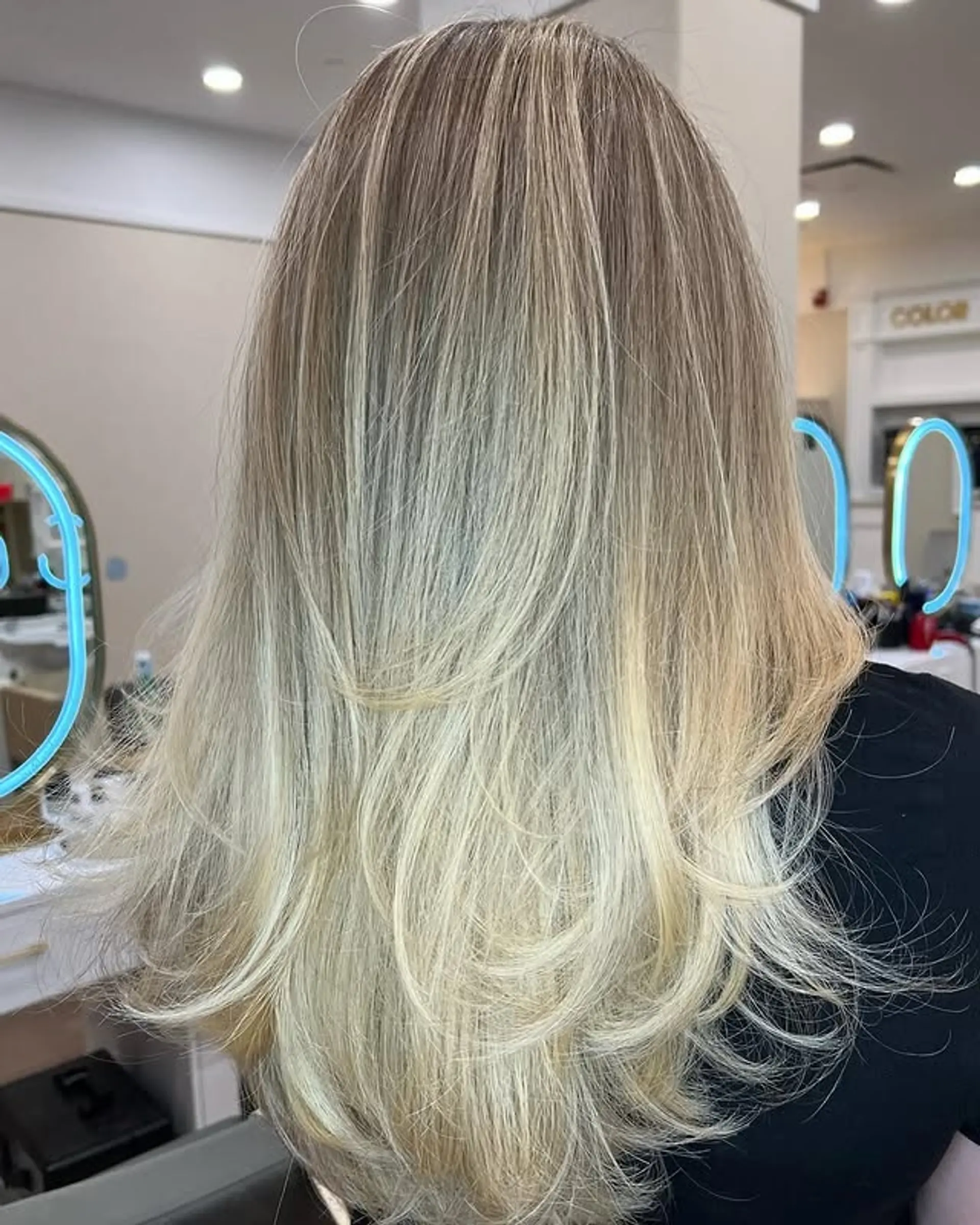 A long layered hairstyle with a bronde balayage. 1