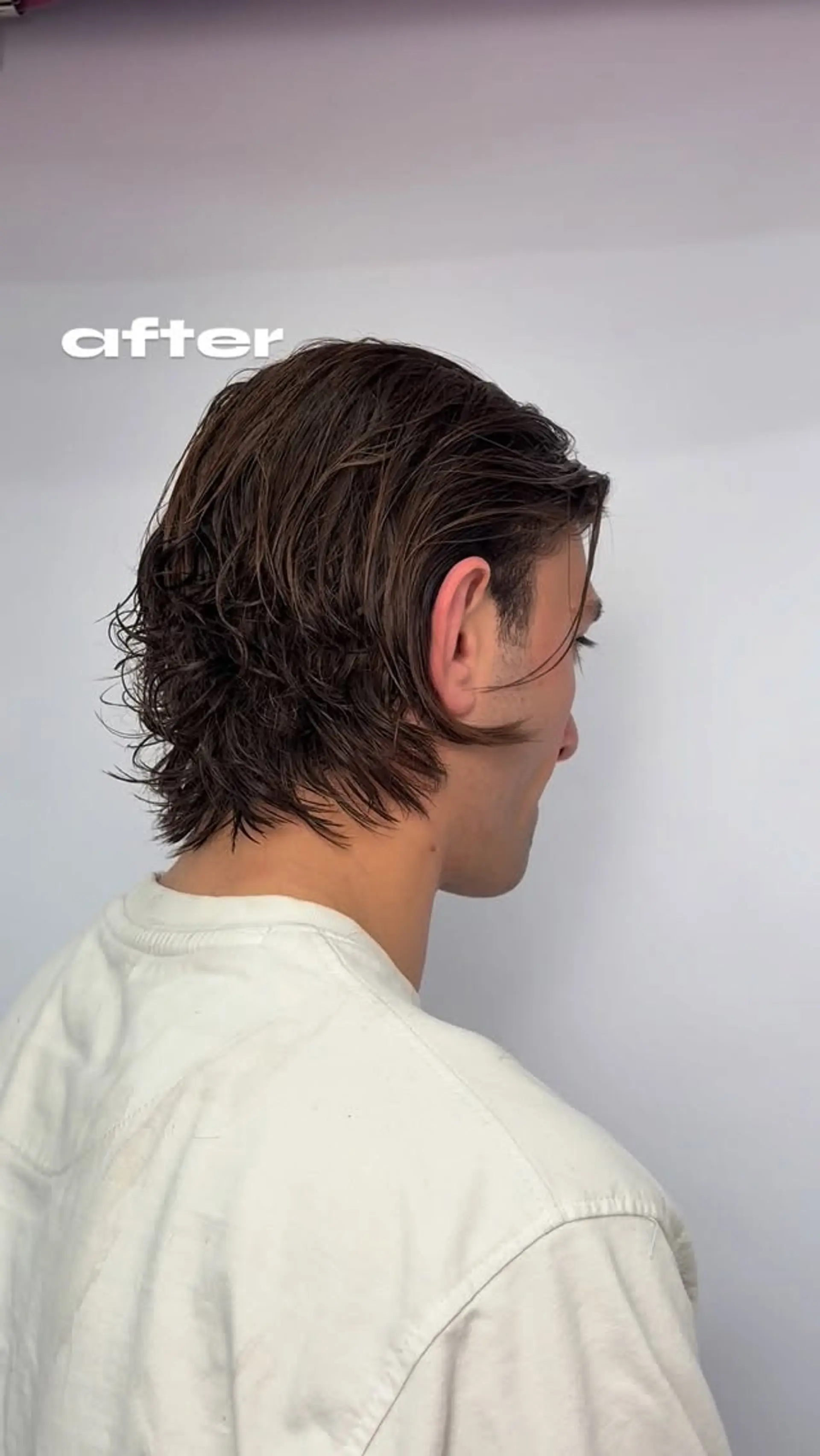 A medium-short textured haircut styled with a glossy wet look, featuring layered pieces pushed back toward the nape. 1