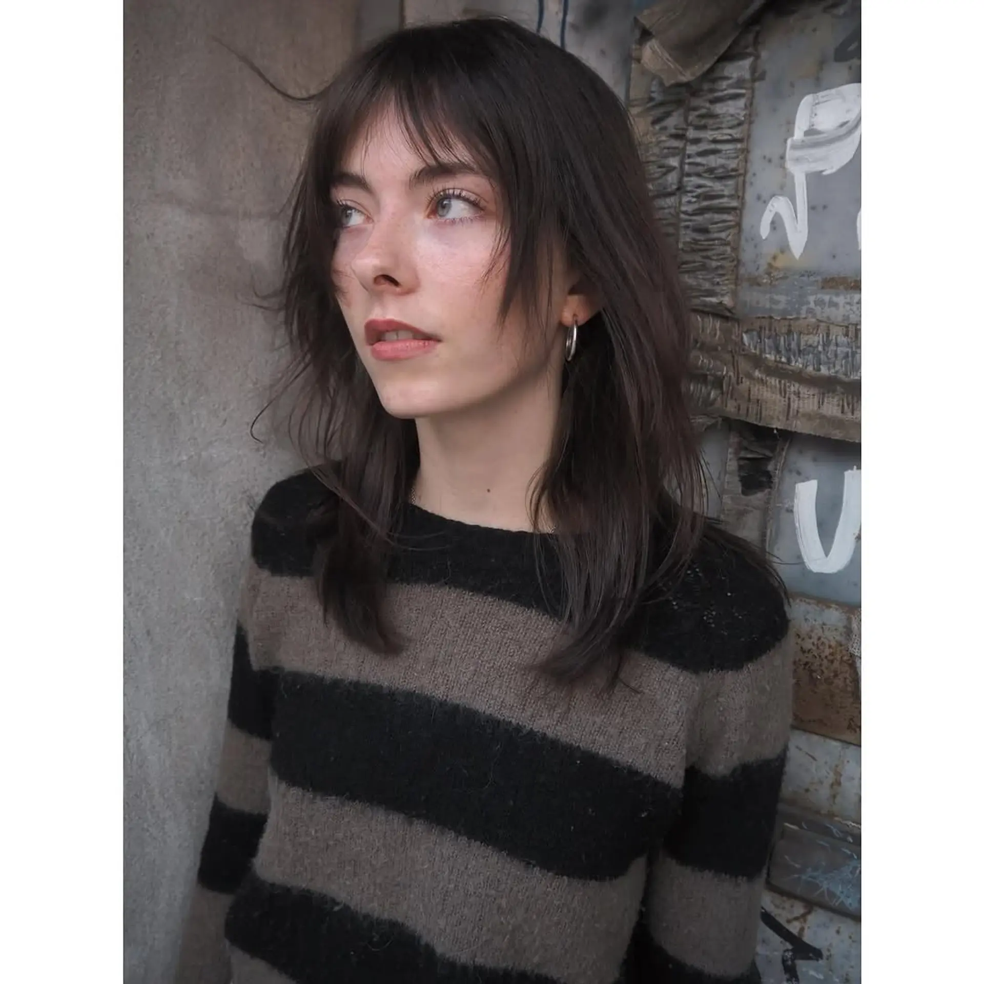 A medium-length shag with choppy layers and wispy bangs. 2