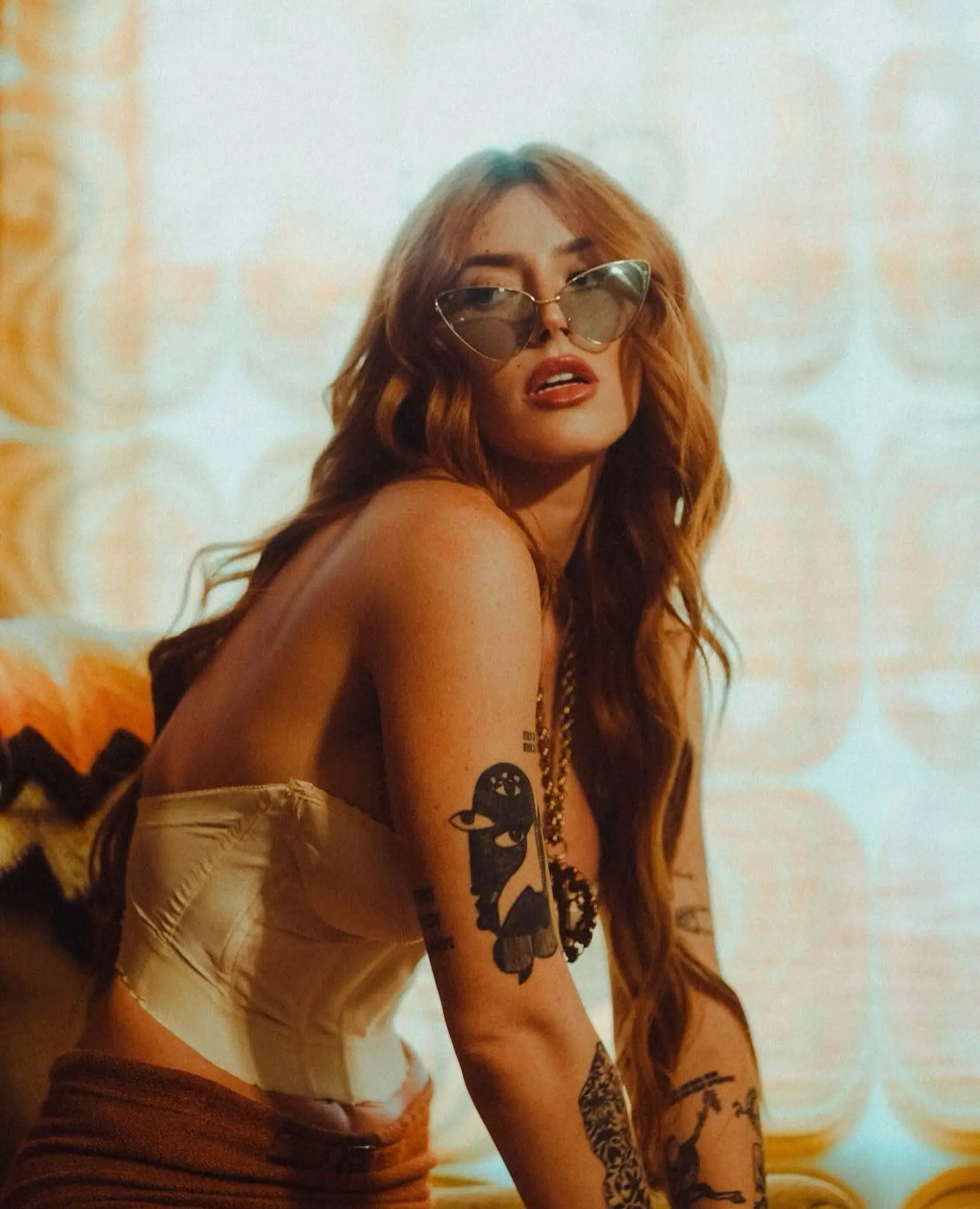 Long, glossy copper waves parted down the middle with a brushed-out, retro-glam finish. 1