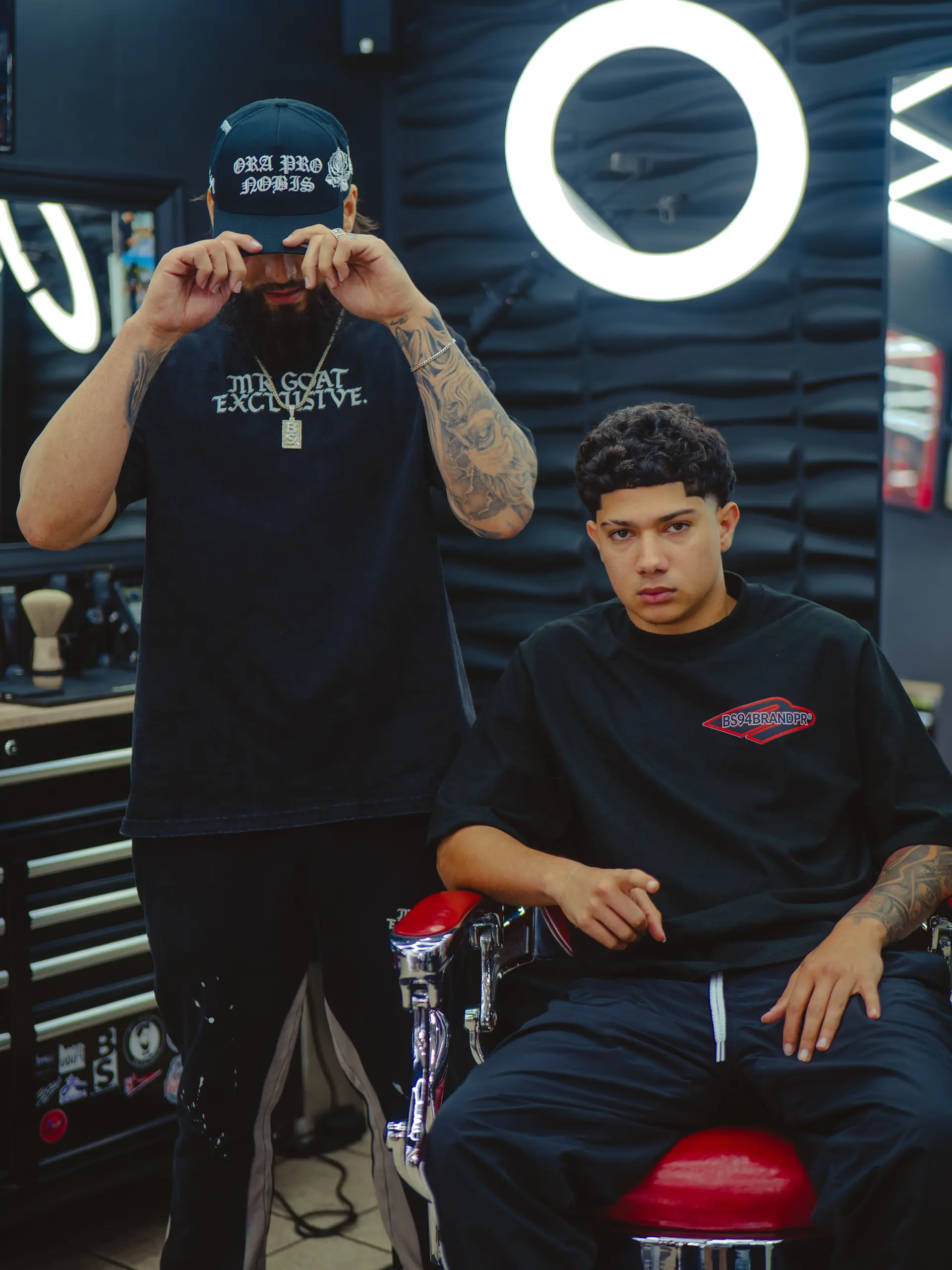 A short men's crop featuring natural curls on top paired with a sharp, clean forehead lineup. 1