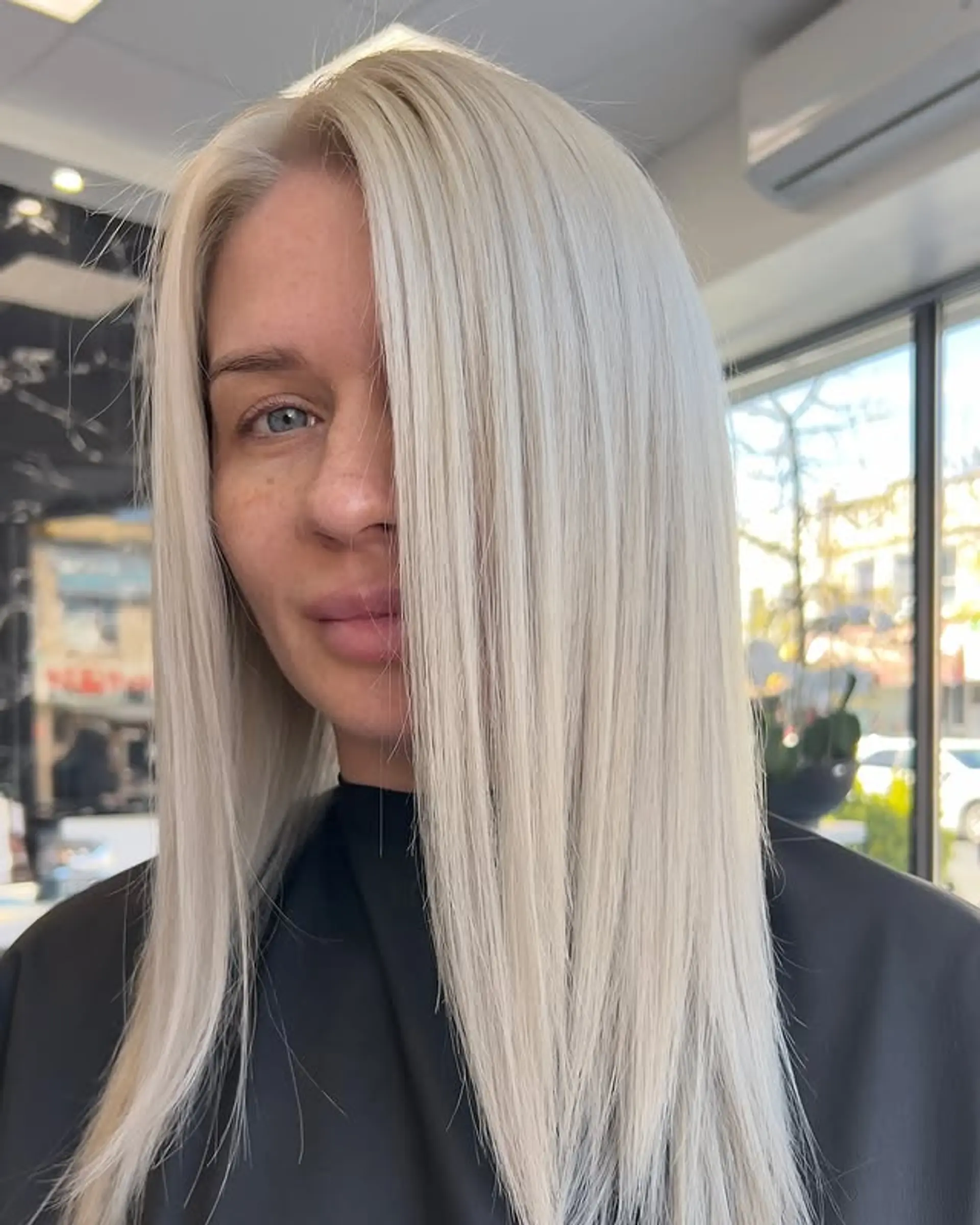 Long, straight platinum blonde hair with face-framing layers. 1