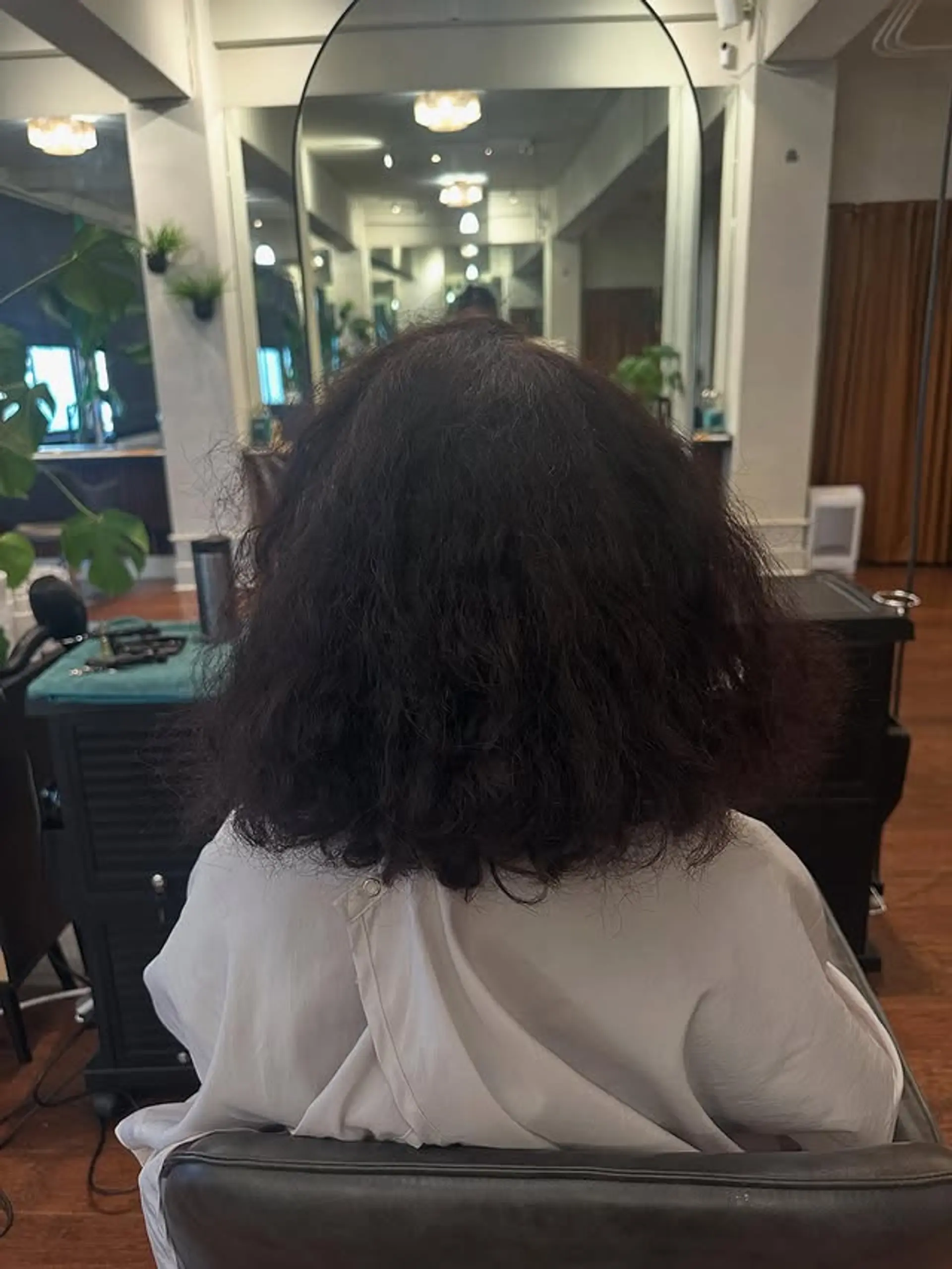 A medium-length, textured bob that accentuates natural curls. 1