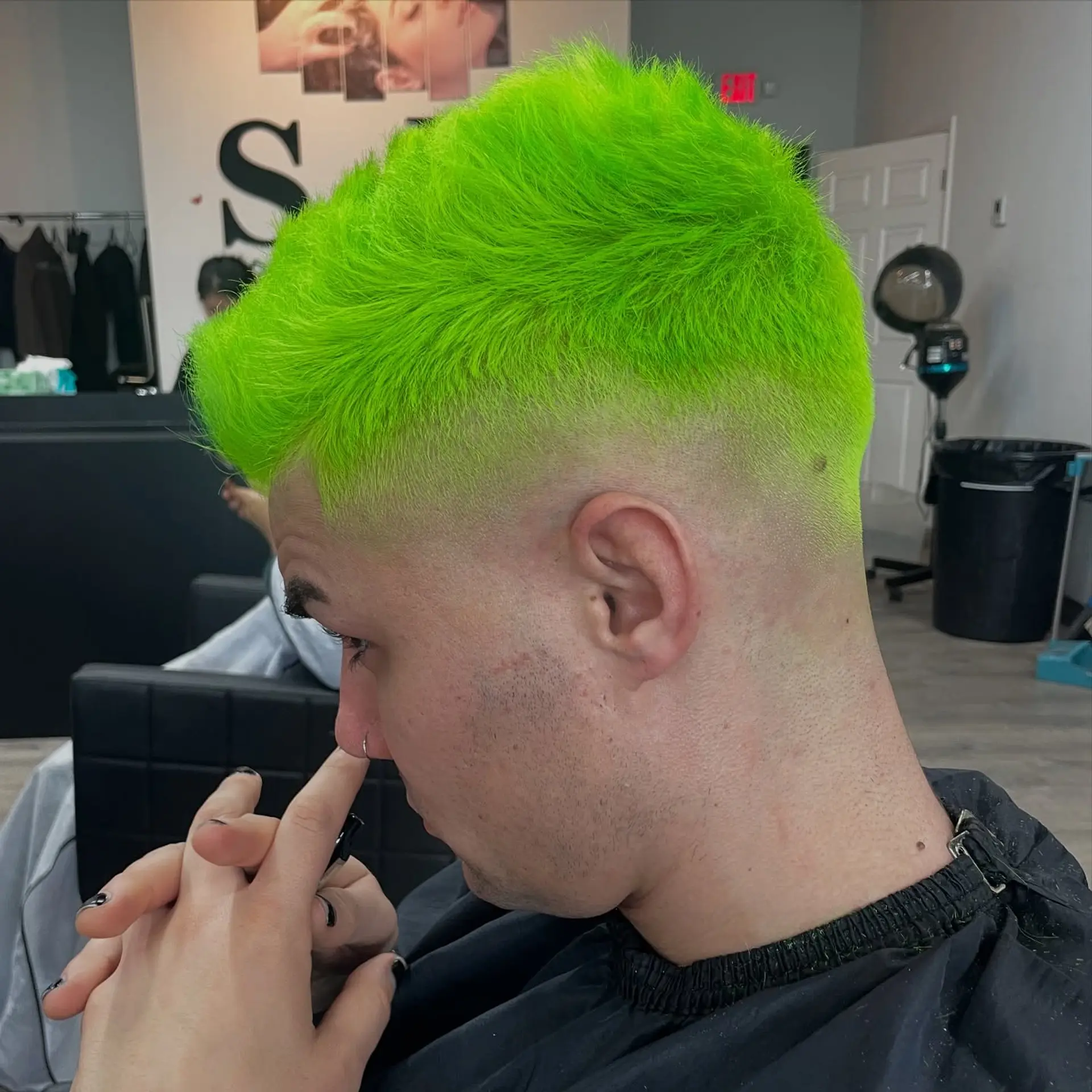 Short buzz cut with a fade, featuring a bold neon green color on top. 1