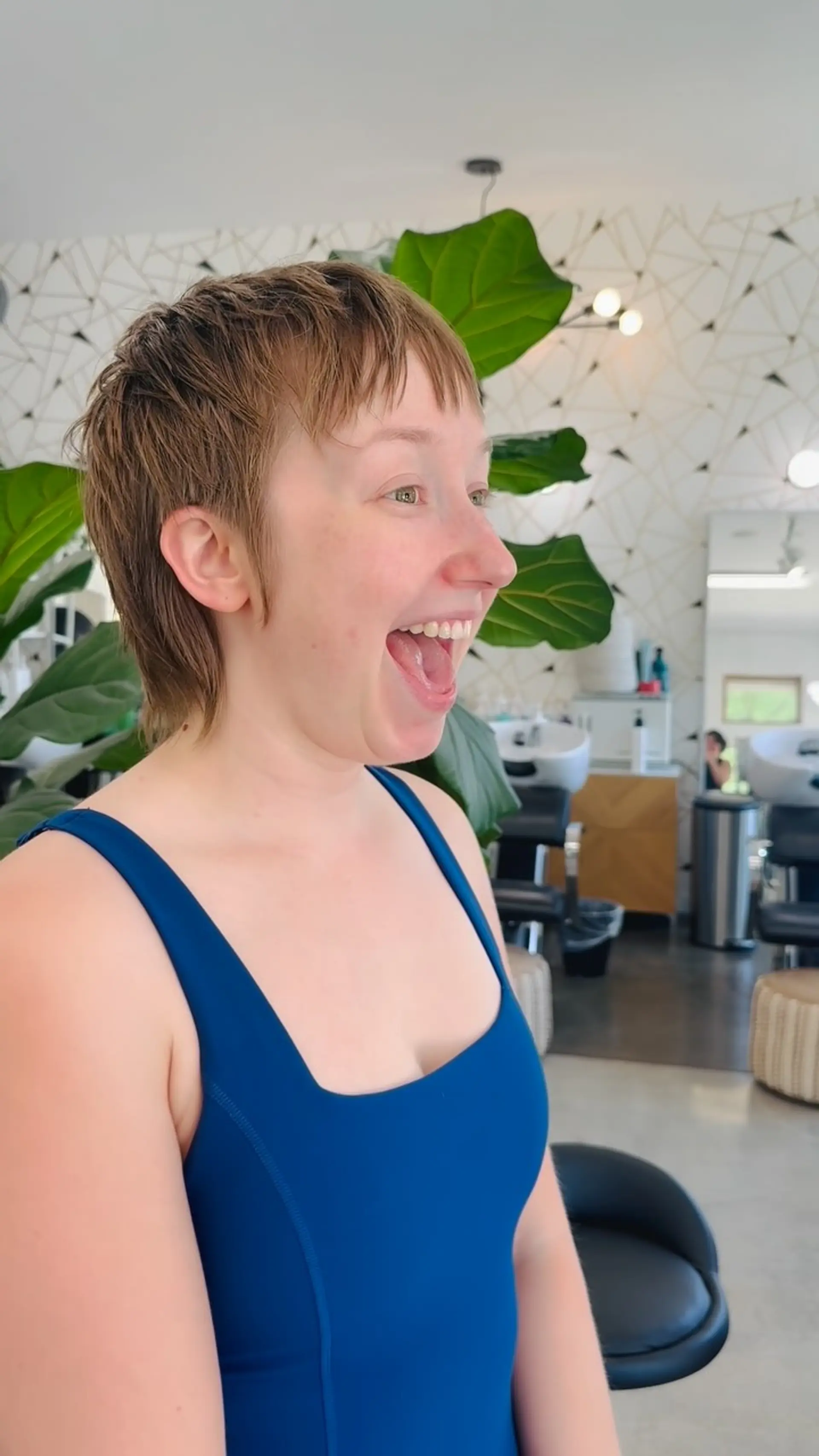 A textured short pixie mullet with wispy micro bangs and a softly tapered nape. 1