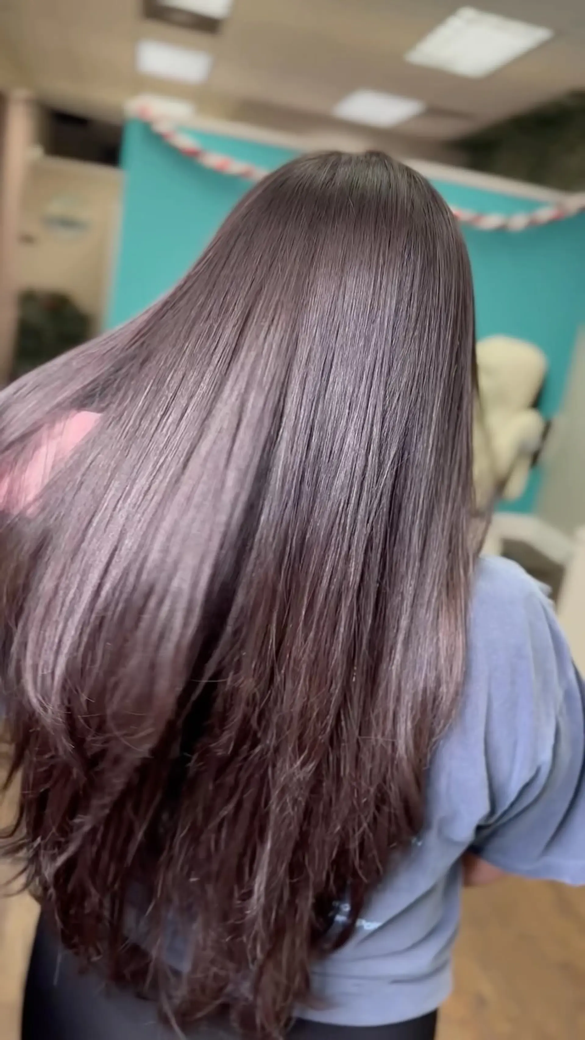 Ultra-glossy and smooth long straight brunette hair displaying exceptional shine and movement. 1