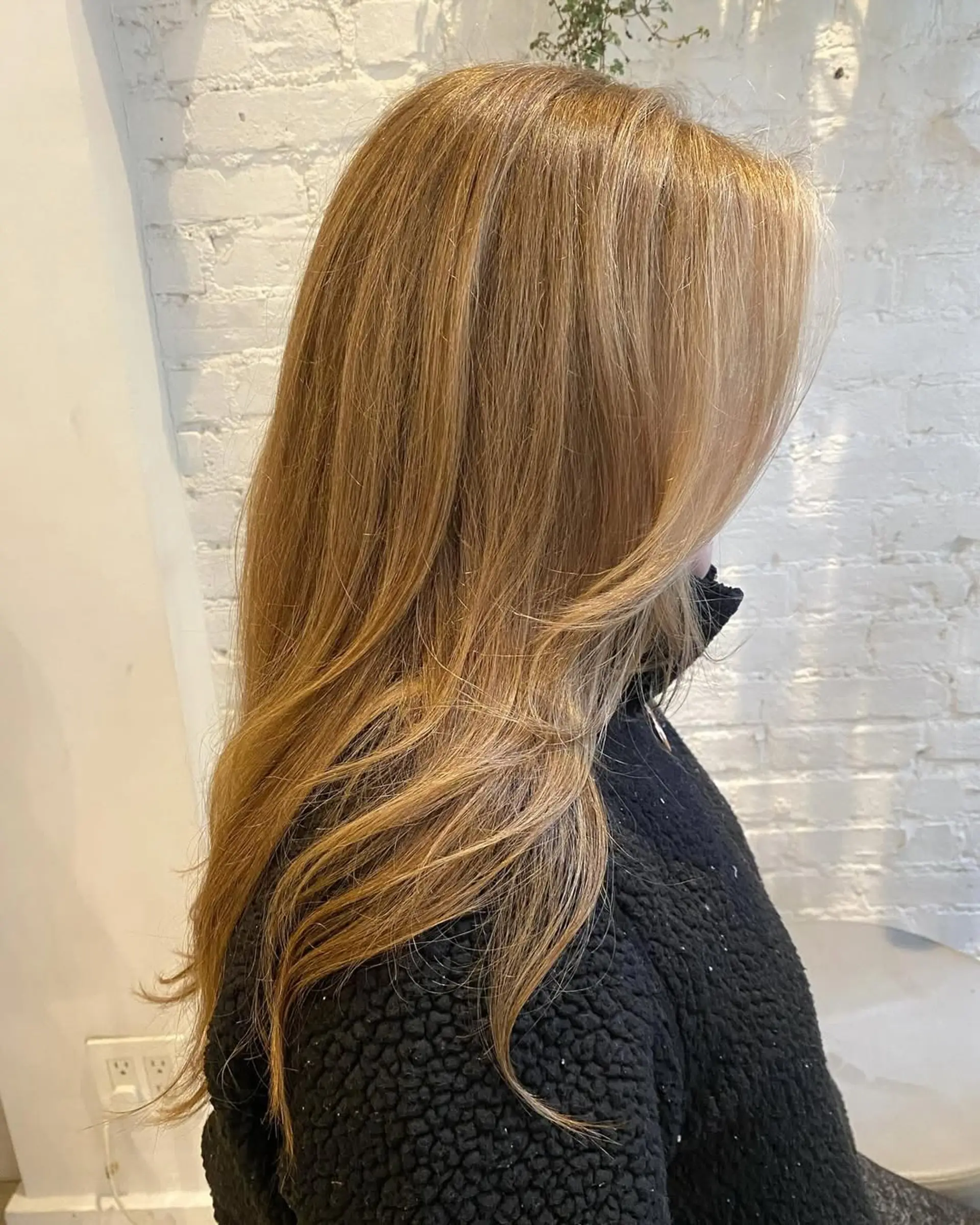 A classic medium-length hairstyle with face-framing layers. 2