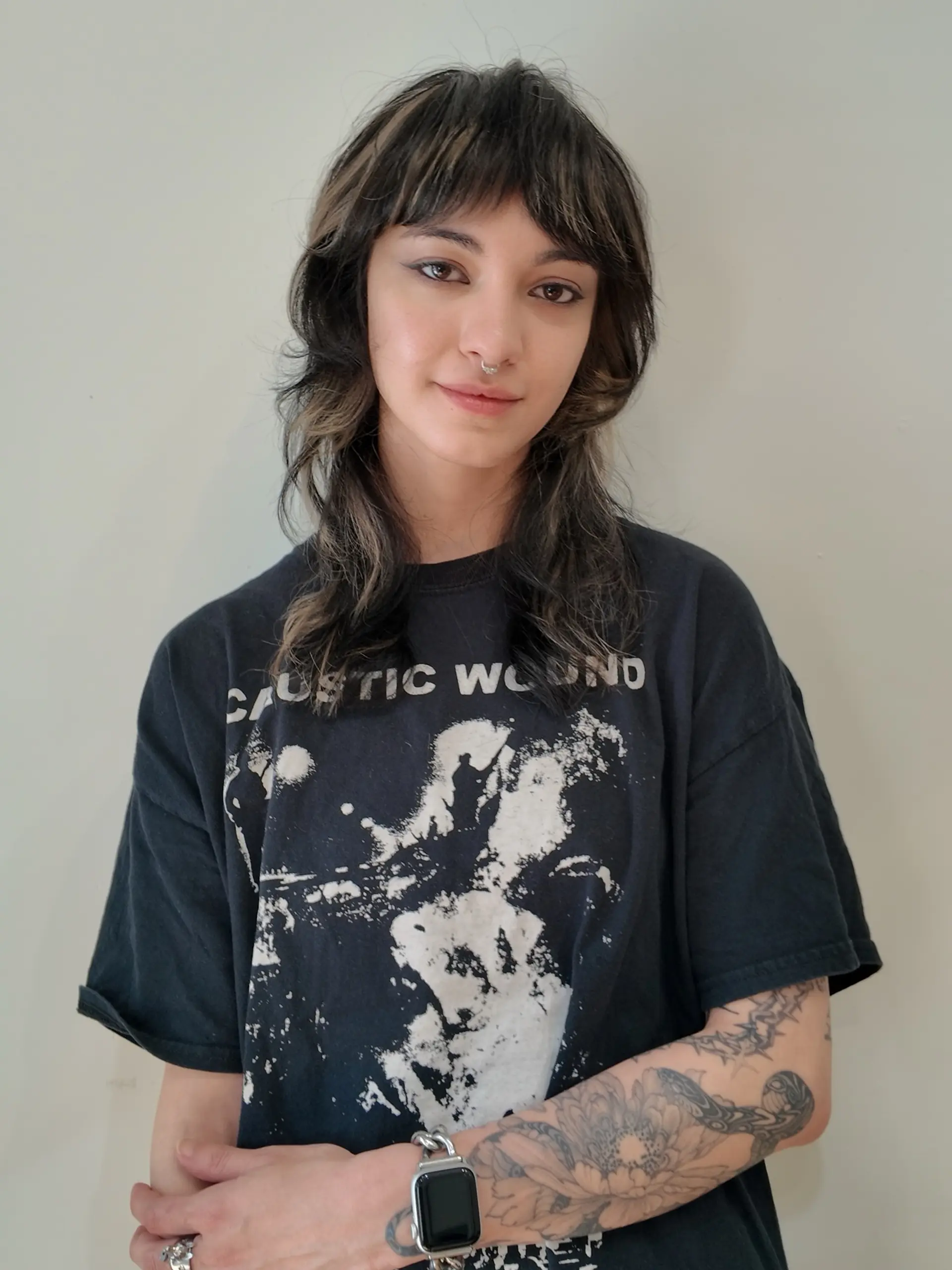 Medium-length layered shag cut featuring textured curtain bangs and chunky high-contrast blonde highlights over a dark base. 1