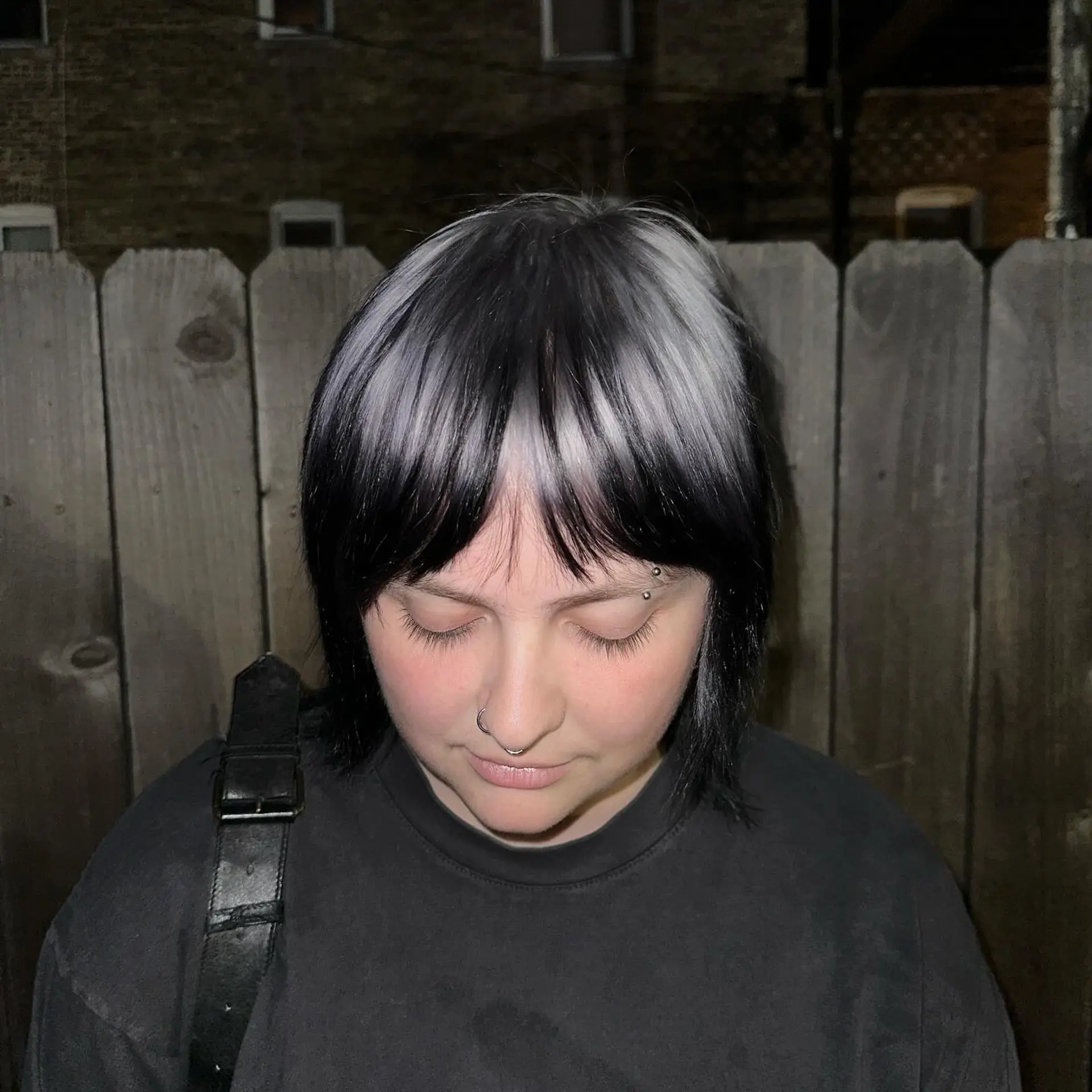 This trendy, medium-length hairstyle features a modern mullet cut with a bold two-tone color contrast. 3