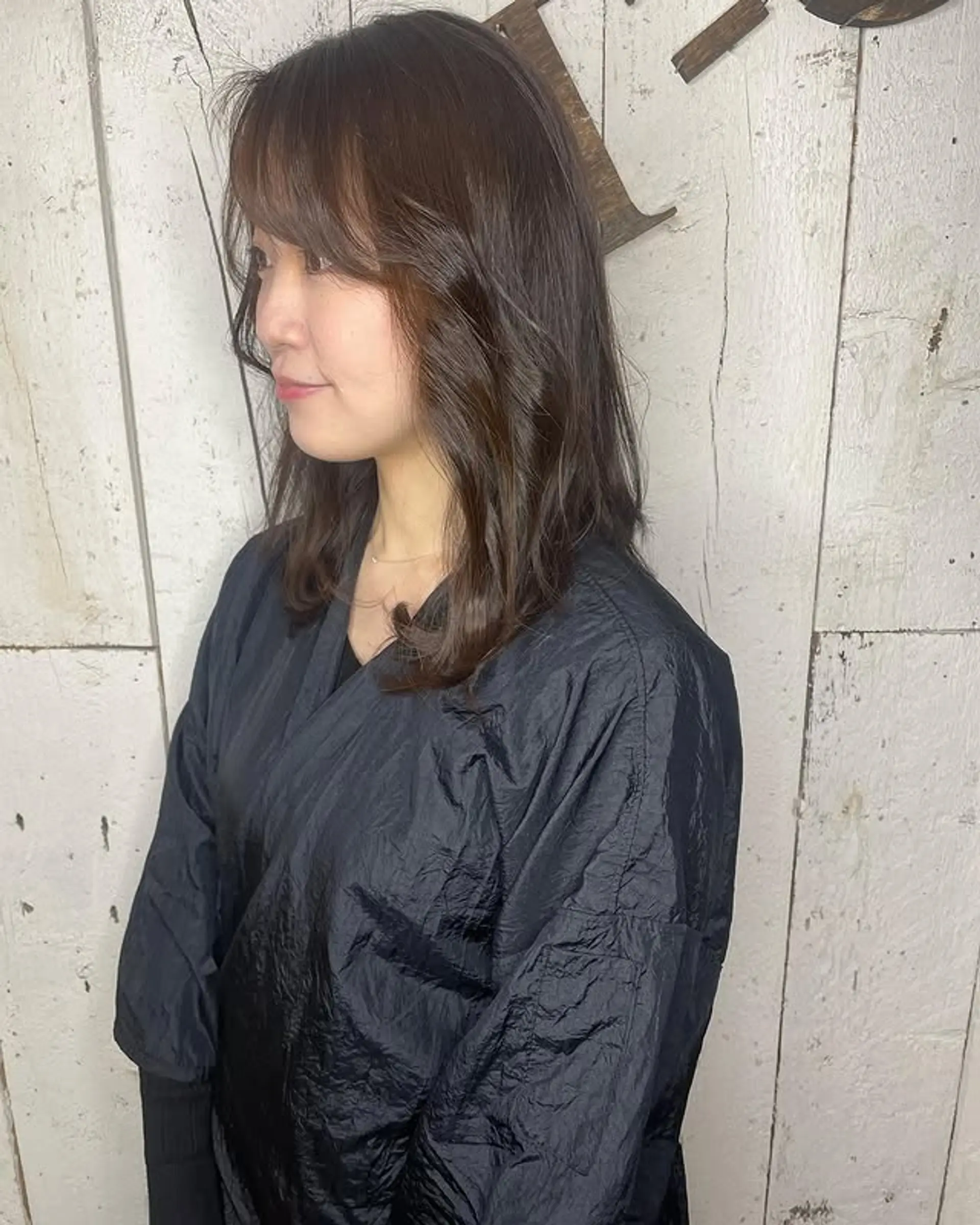 A medium-length shag with face-framing curtain bangs and soft waves. 1