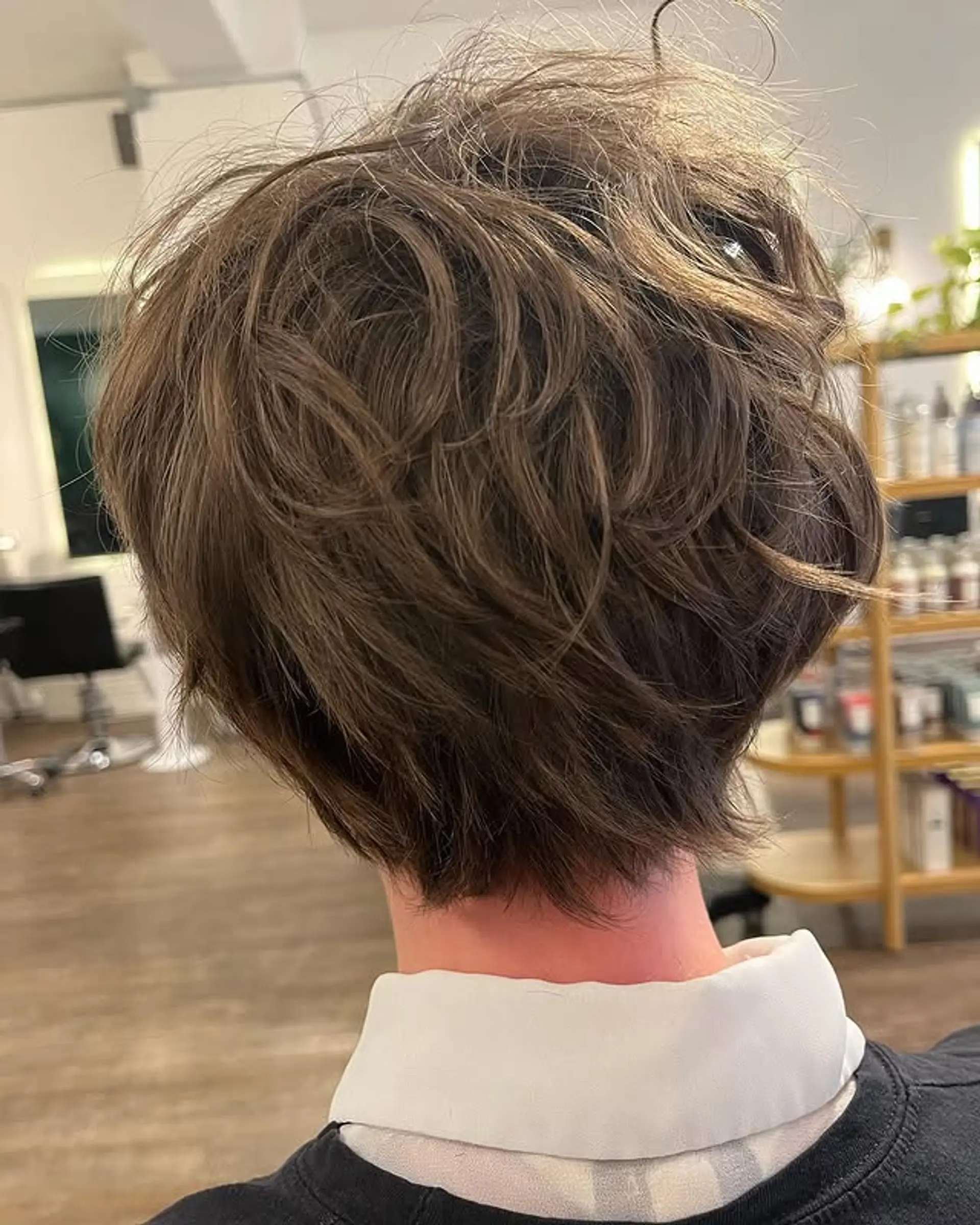 A short, layered bob with a textured finish that adds volume and movement. 1