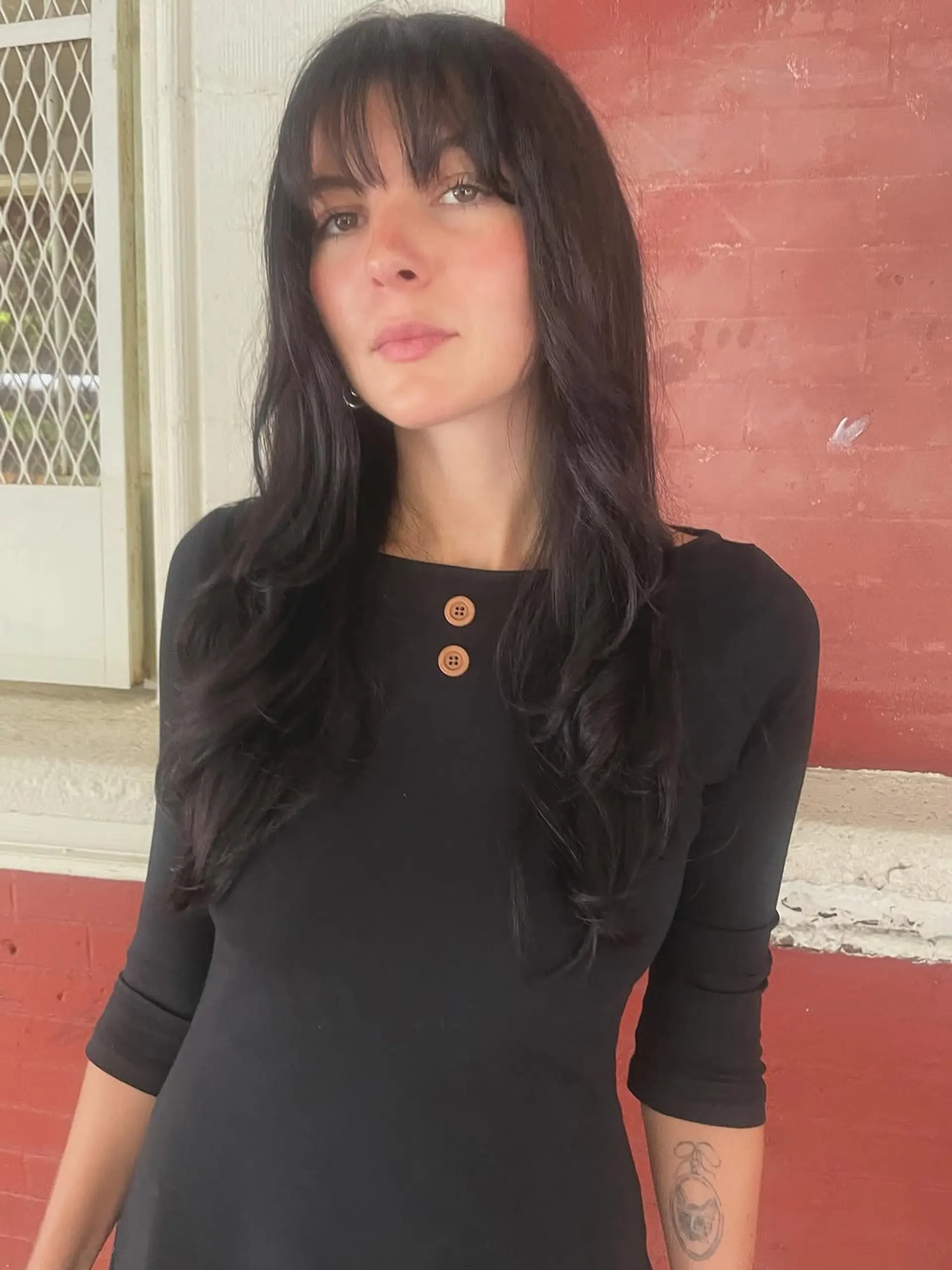 Long hair with soft, face-framing layers and light, airy wispy bangs that create an effortless, romantic silhouette. 1